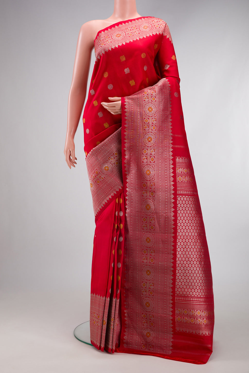 Red Gadwal Silk Saree with Zari Butta on the body and Zari Border.  displayed on a mannequin