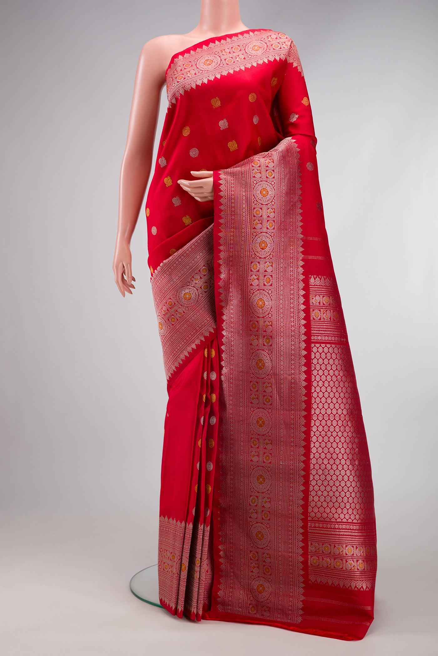 Red Gadwal Silk Saree with Zari Butta on the body and Zari Border.  displayed on a mannequin