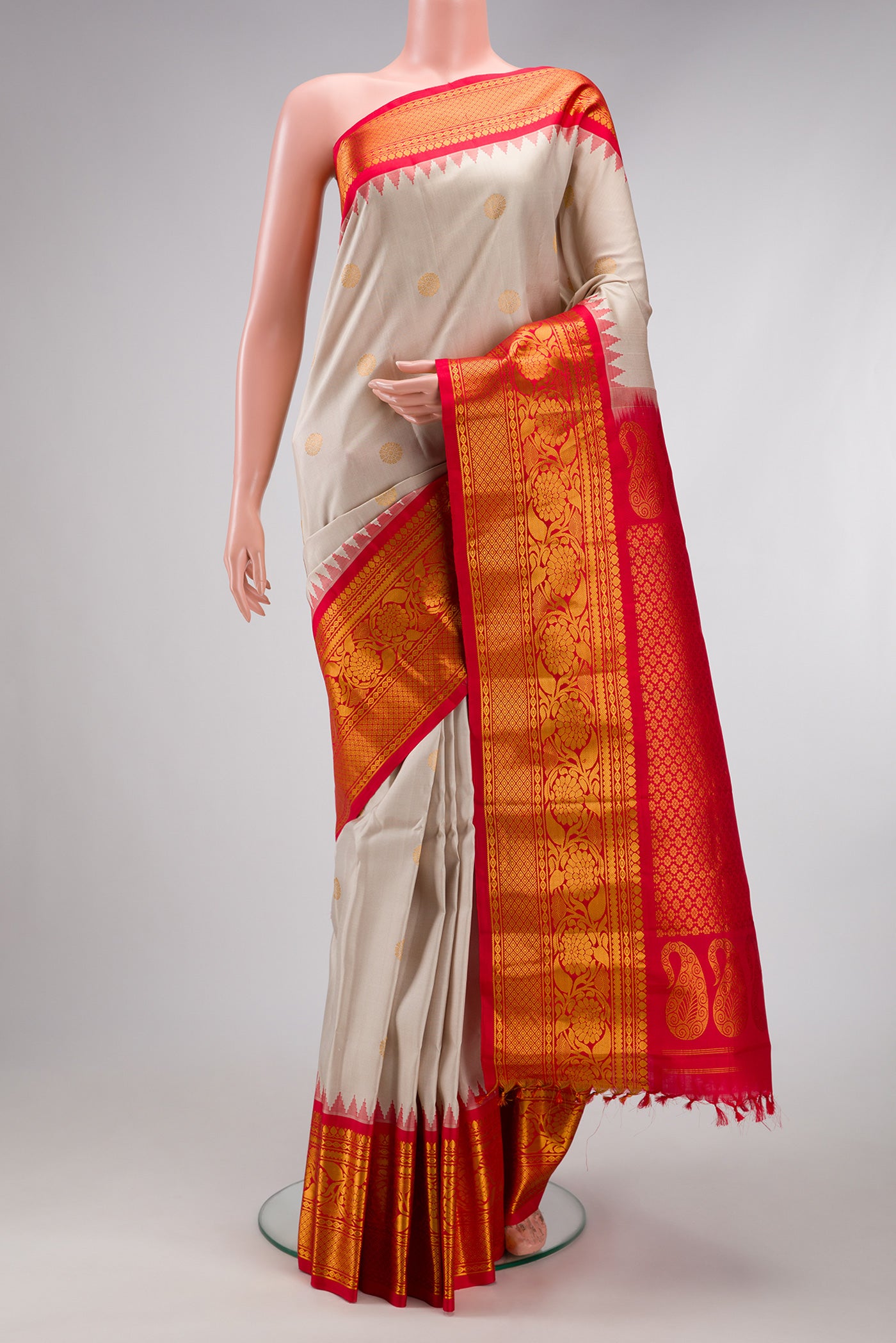 Beige Gadwal Silk Saree with Zari Butta on the body and Fancy Border.  displayed on a mannequin
