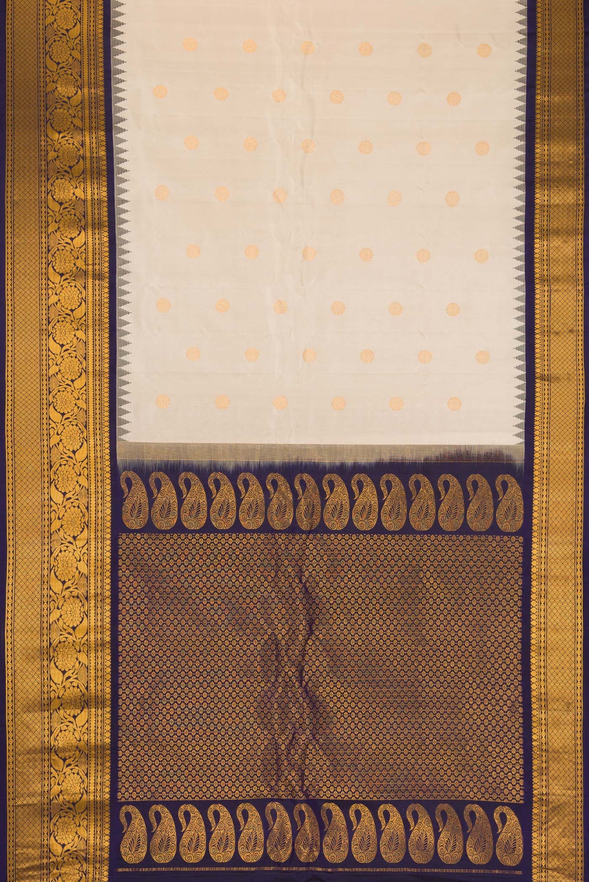 Flat view of Cream Gadwal Silk Saree with Zari Butta on the body and Zari Border. 