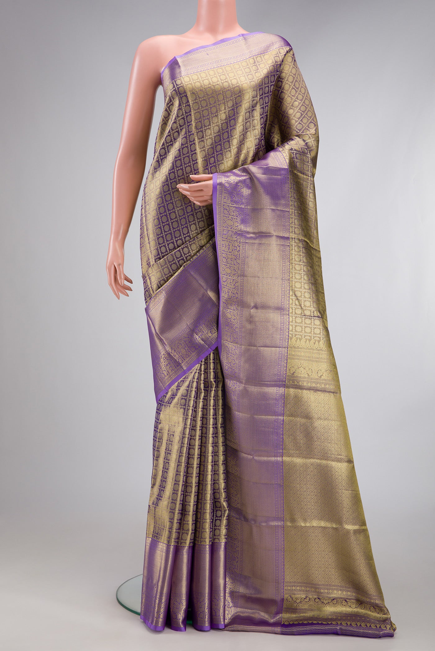 Purple Dual Tone Kanchipuram Tissue Silk Saree with Zari Brocade on the body and Zari Border.  displayed on a mannequin