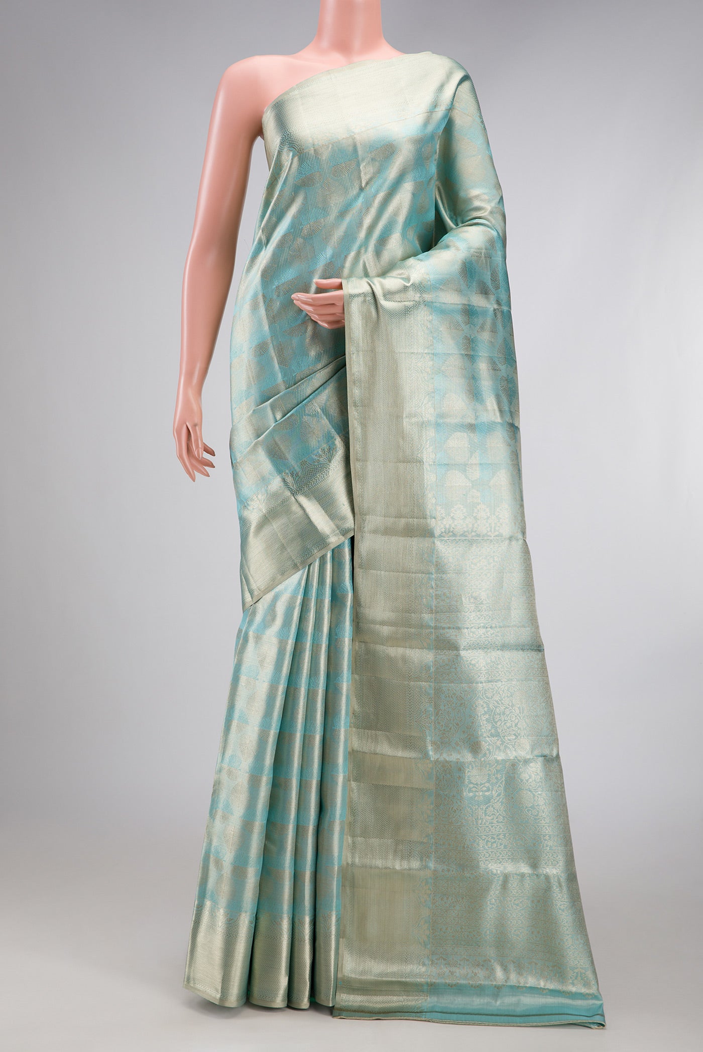 Sky Blue Dual Tone Kanjivaram Tissue Silk Saree with Zari Brocade on the body and Zari Border.  displayed on a mannequin