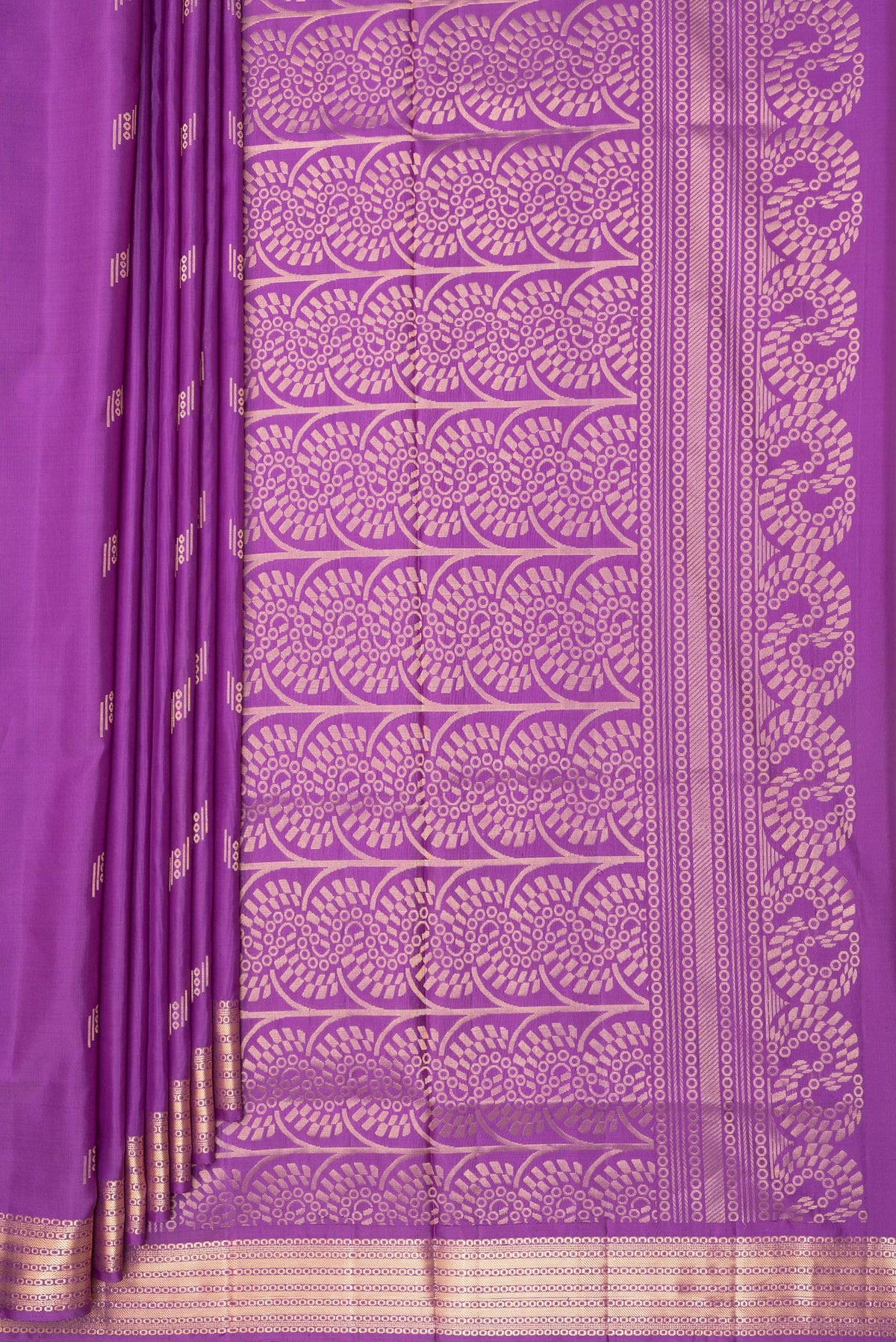 Pleats and pallu of Pure Silk Purple Soft Saree with Zari Butta on the body and Zari Border. 