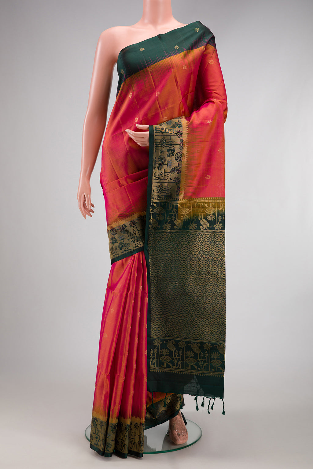 Coral Dual Tone Soft Silk Saree with Zari Butta on the body and Fancy Border.  displayed on a mannequin