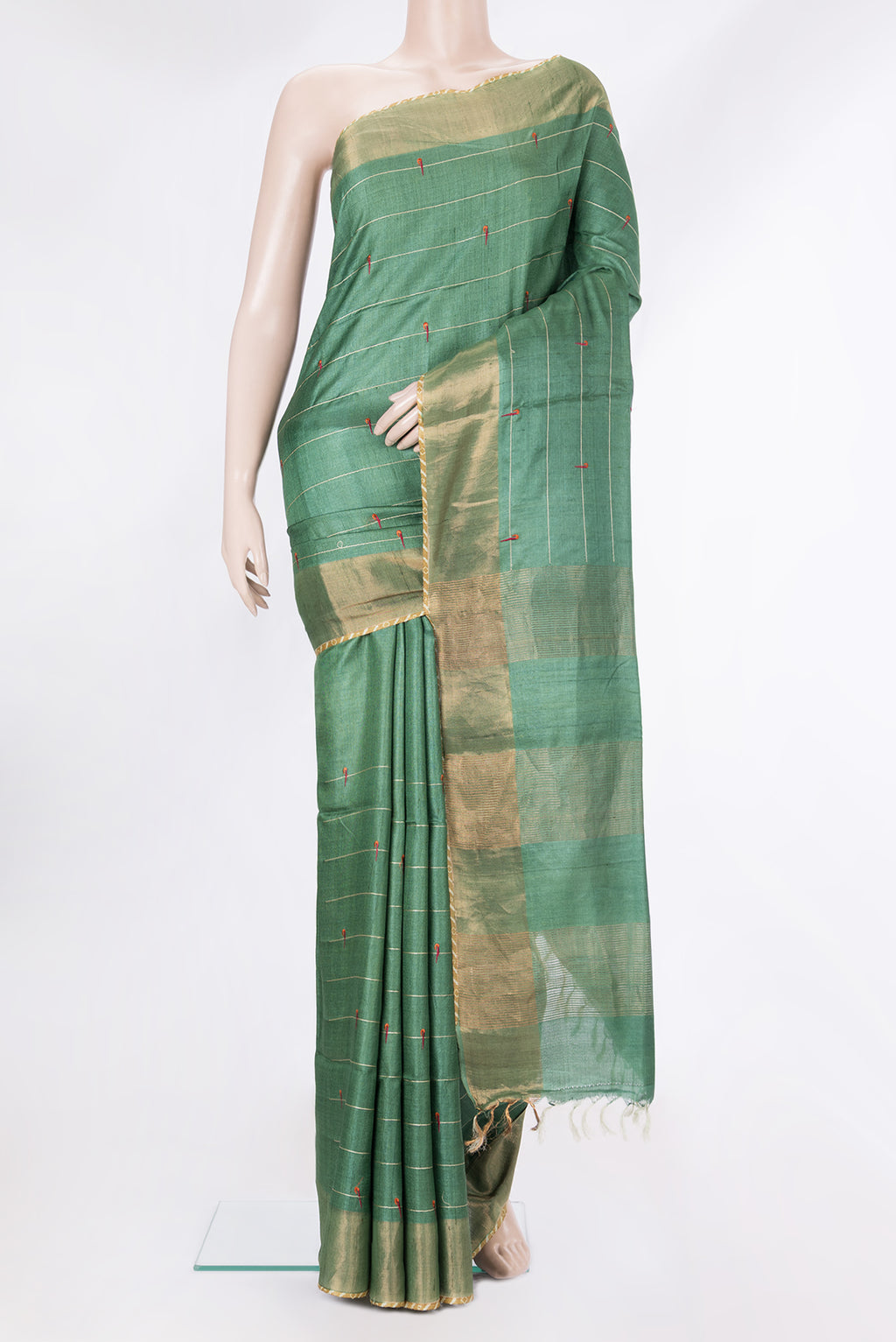 Green Tussar Saree with Stripes on the body and Zari Border.  displayed on a mannequin