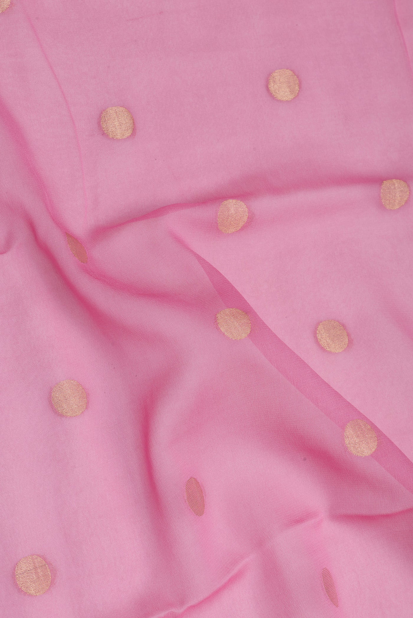 Close up of Rose pink Mysore Georgette Saree with Zari Butta on the body and Zari Border.  displaying folds