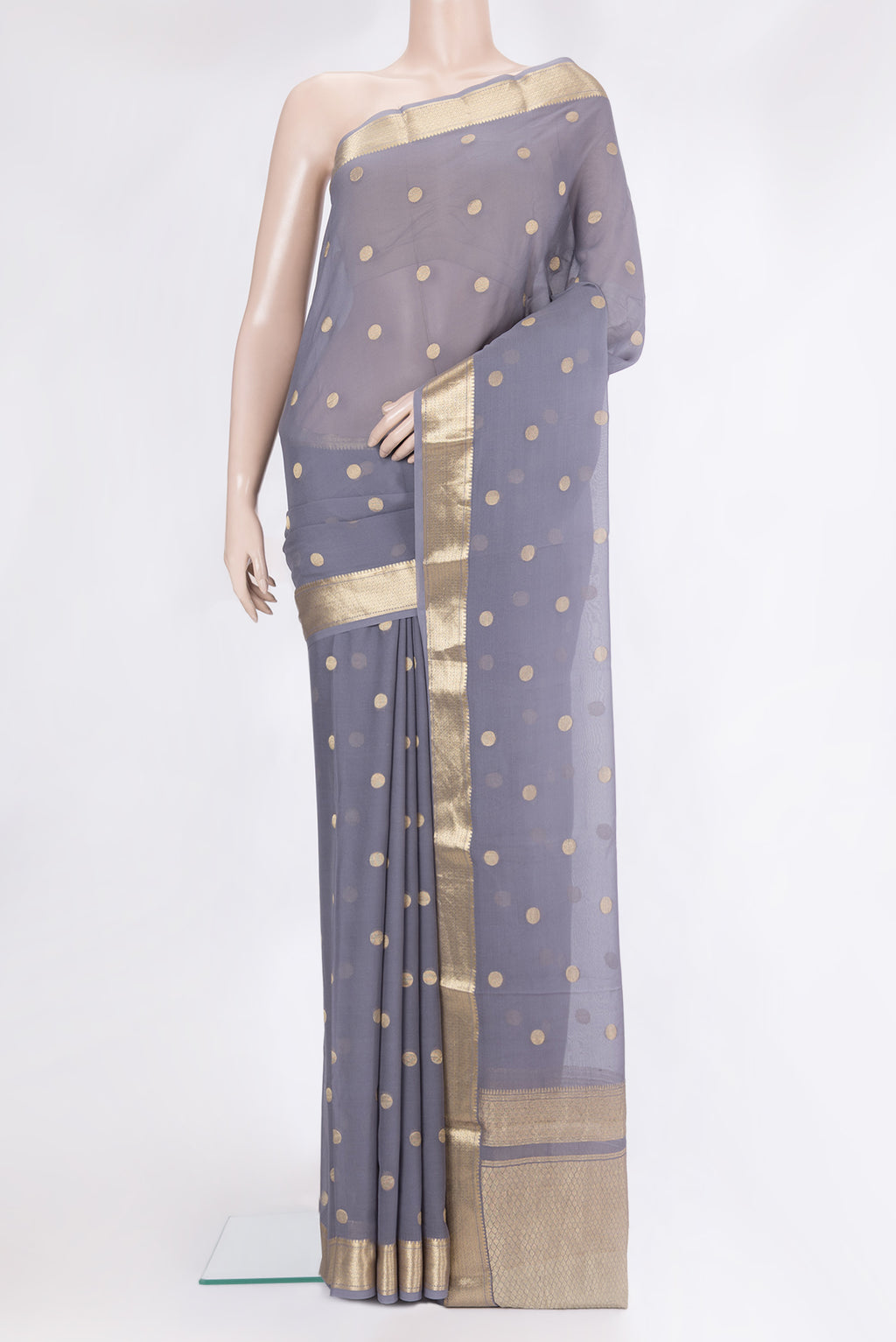 Grey Mysore Georgette Saree with Zari Butta on the body and Zari Border.  displayed on a mannequin