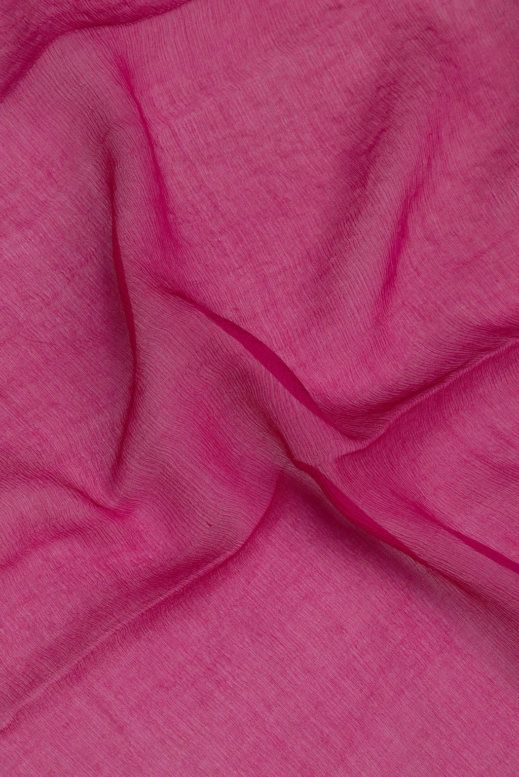 Close up of Magenta Mysore Chiffon Saree with Plain Body and Zari Border.  displaying folds