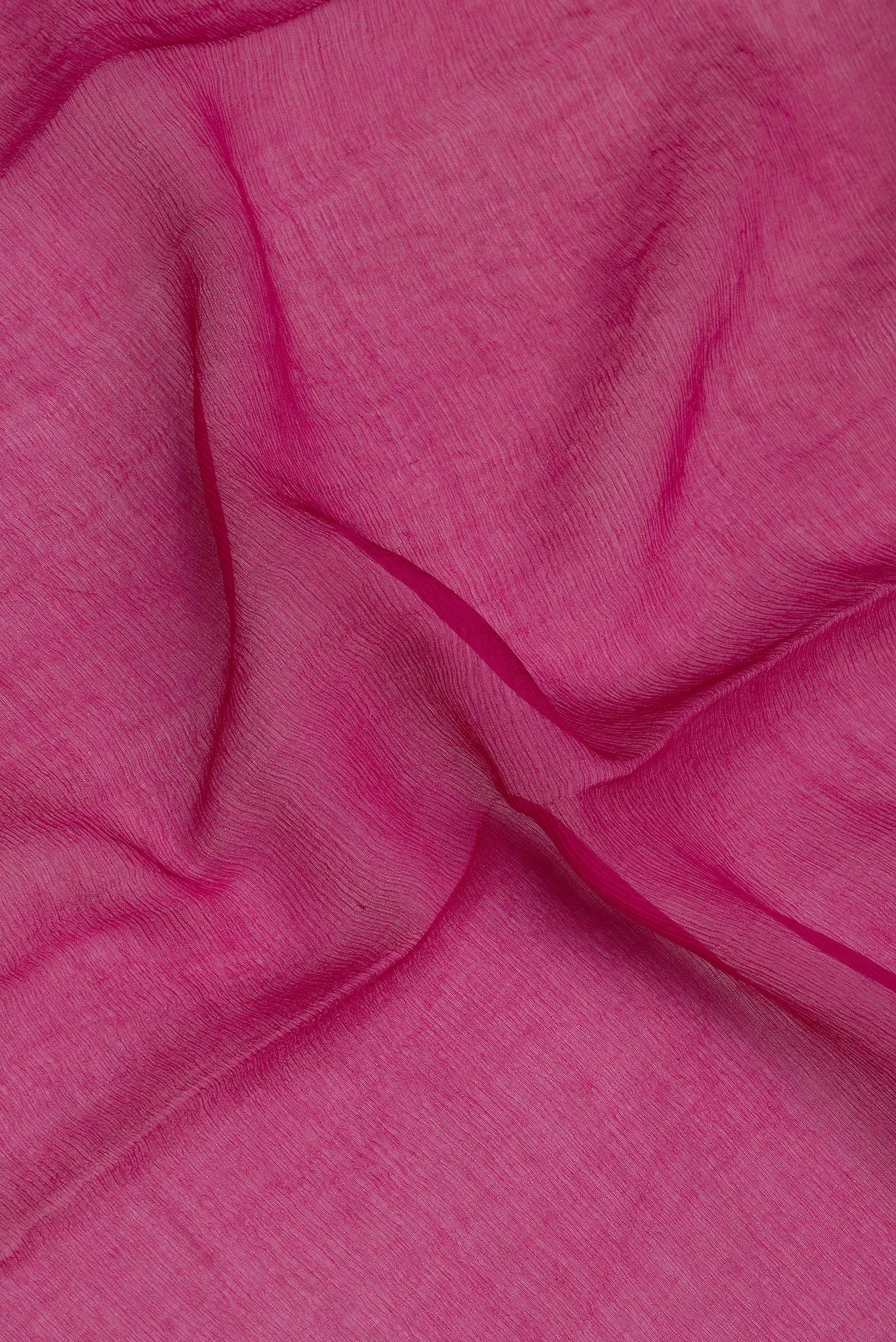 Close up of Magenta Mysore Chiffon Saree with Plain Body and Zari Border.  displaying folds