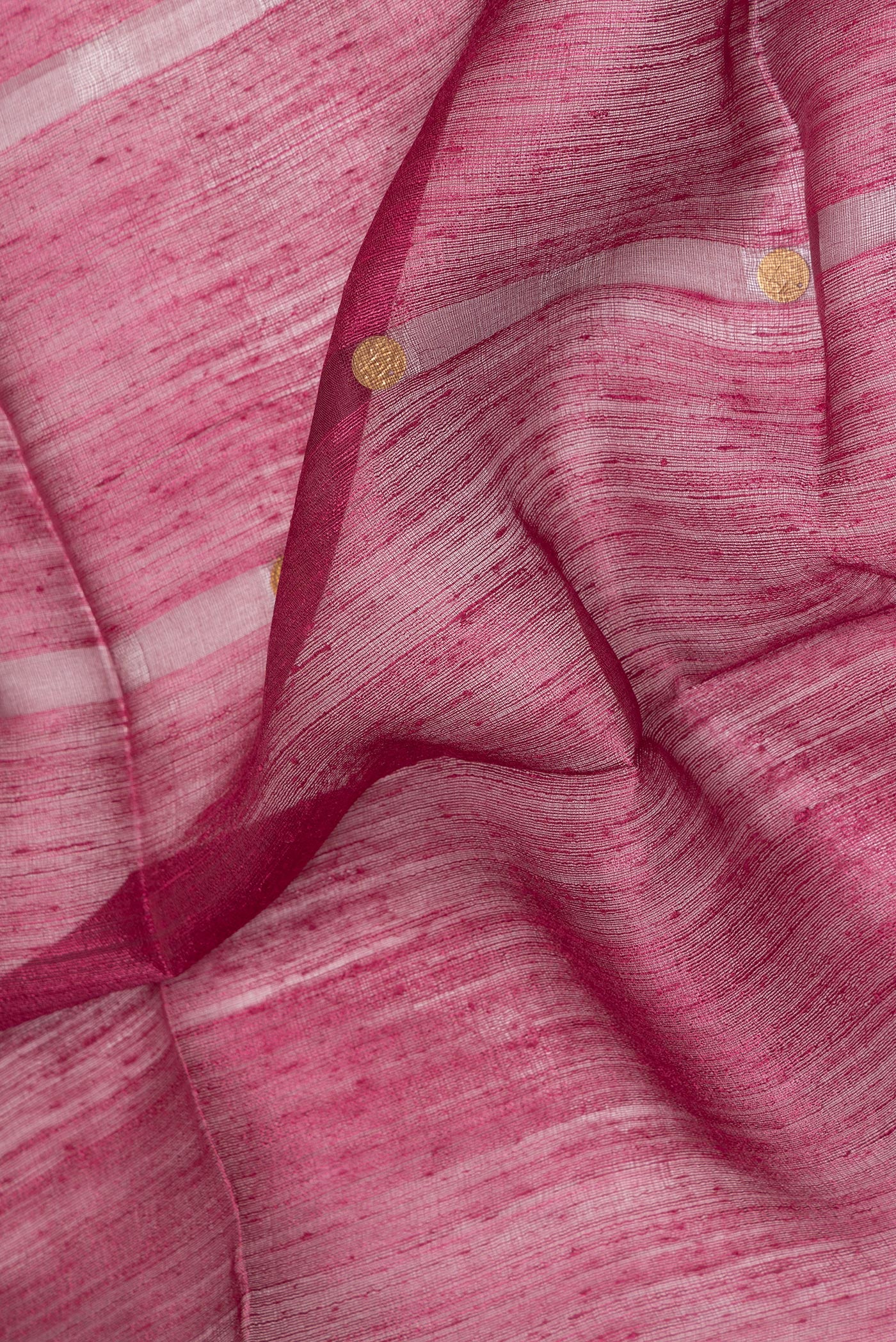 Close up of Pure Silk Maroon Tussar Saree with Embroidery on the body and Without Border.  displaying folds