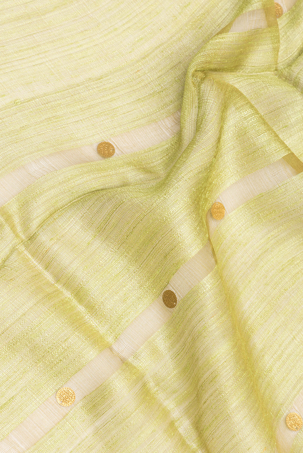 Close up of Mehandi Green Tussar Saree with Embroidery on the body and Without Border.  displaying folds