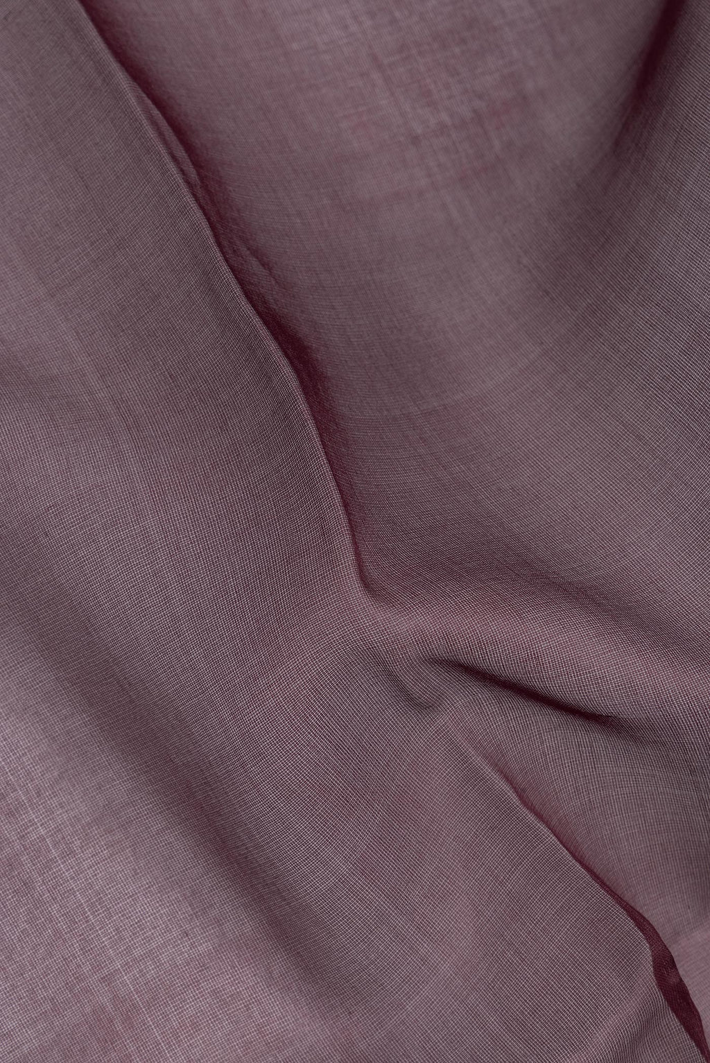 Close up of Pure Silk Burgundy Dual Tone Tussar Saree with Plain Body and Fancy Border.  displaying folds