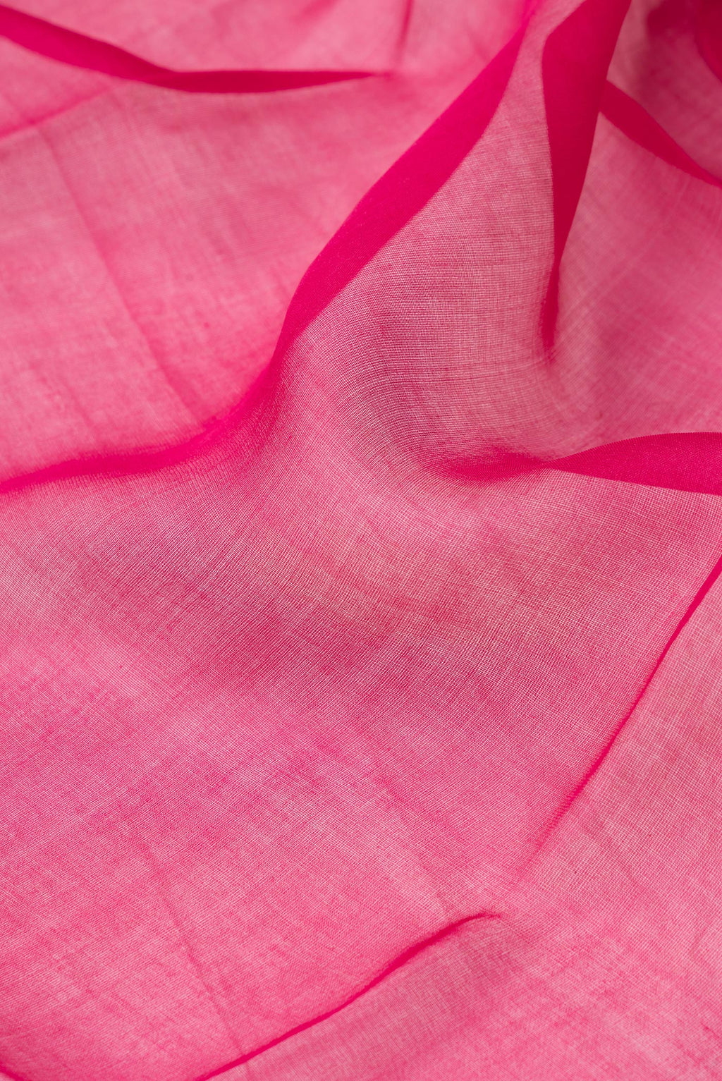 Close up of Dark Pink Organza Silk Saree with Plain Body and Fancy Border.  displaying folds