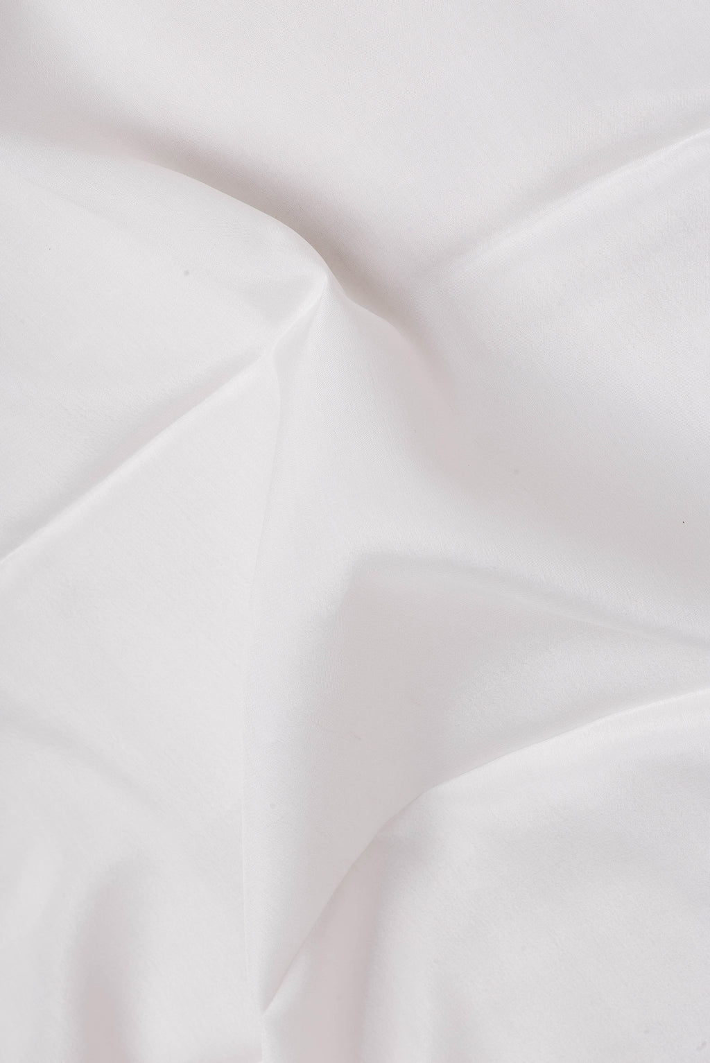Close up of Off White Mysore Silk Saree with Plain Body and Fancy Border.  displaying folds