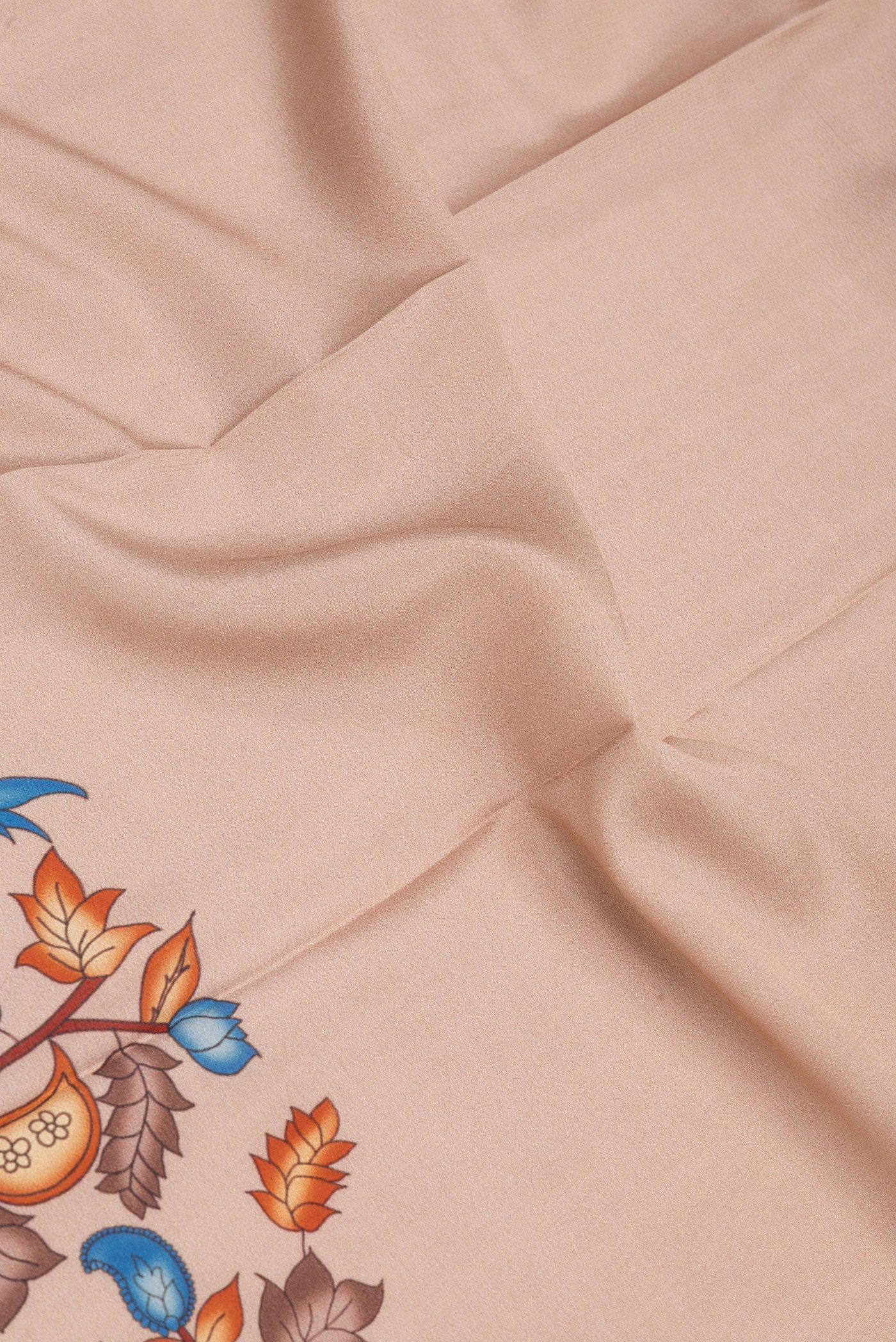 Close up of Beige Mysore Crepe Saree with Plain Body and Fancy Border.  displaying folds