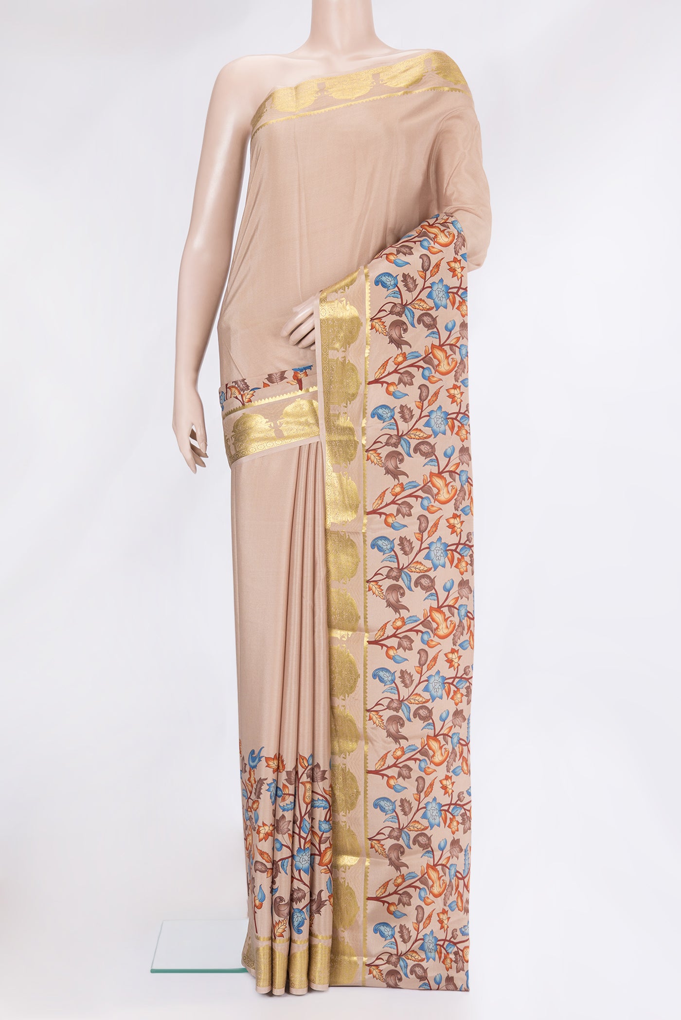 Beige Mysore Crepe Saree with Plain Body and Fancy Border.  displayed on a mannequin