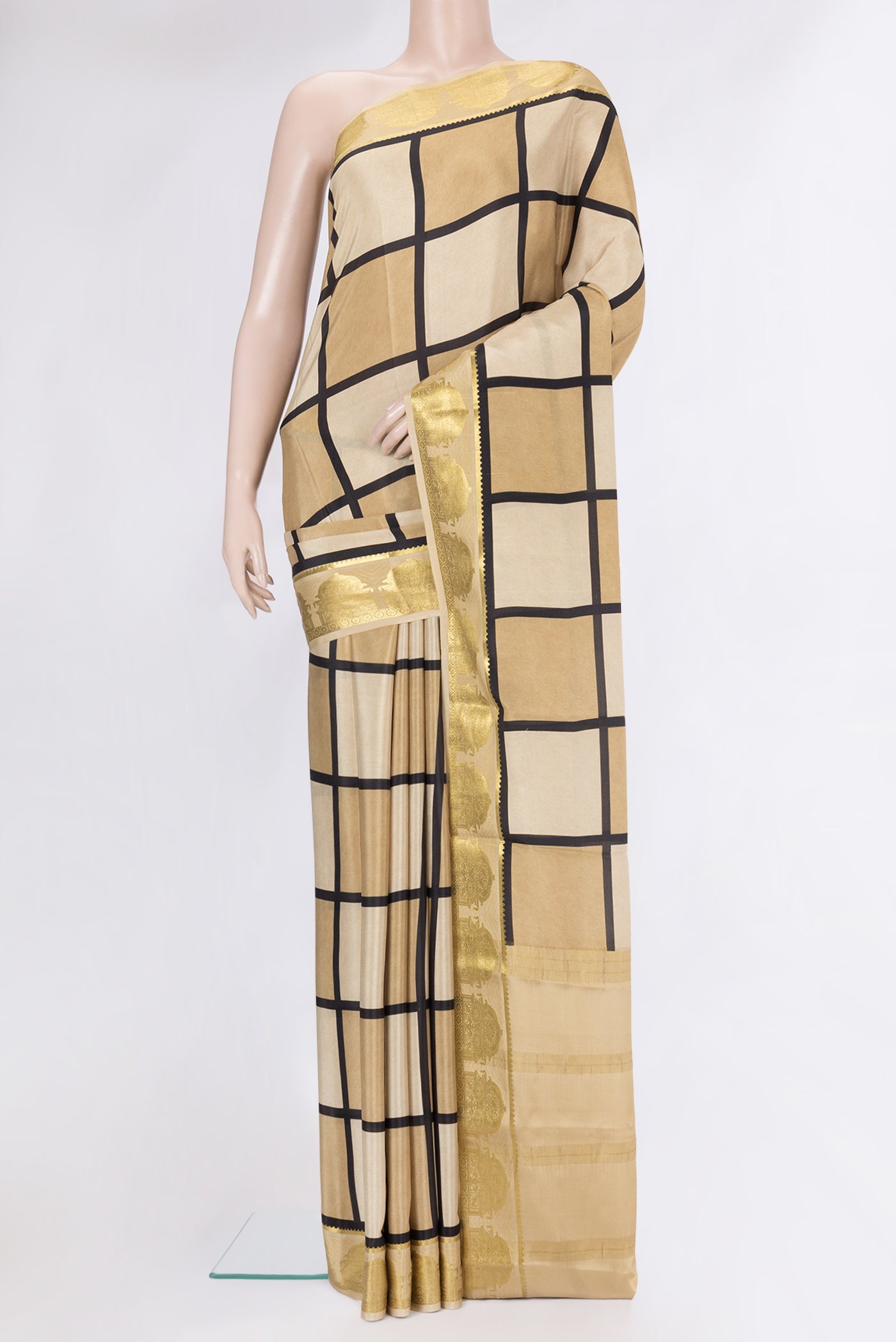 Beige Mysore Silk Saree with Printed design on the body and Fancy Border.  displayed on a mannequin