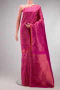 Magenta Kanjivaram Silk Saree with Zari Brocade on the body and Zari Border.  displayed on a mannequin
