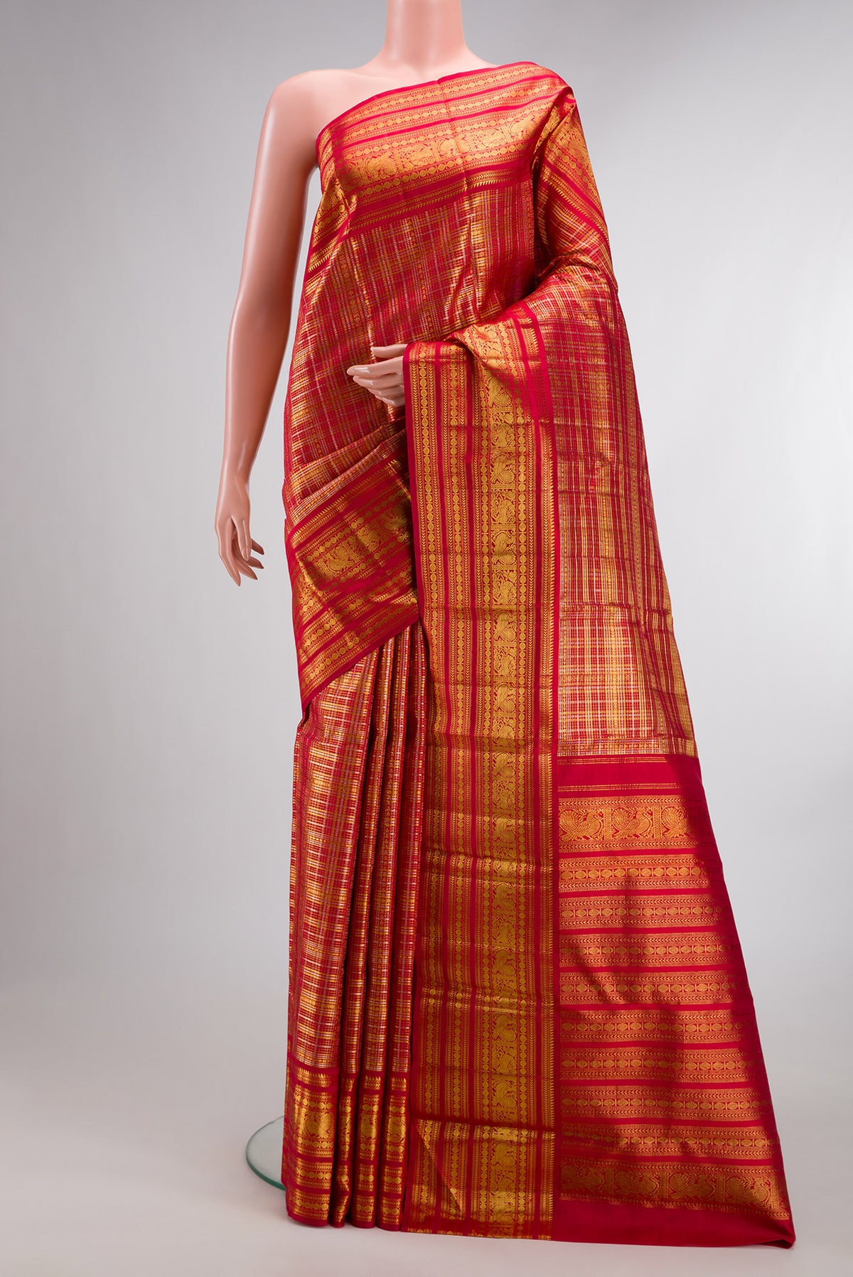 Pure Silk Red Kanchipuram Saree with Zari Brocade on the body and Fancy Border.  displayed on a mannequin