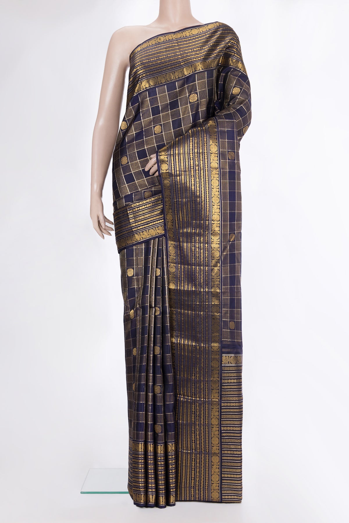 Pure Silk Navy Blue Kanchipuram Saree with Checked design on the body and Fancy Border.  displayed on a mannequin