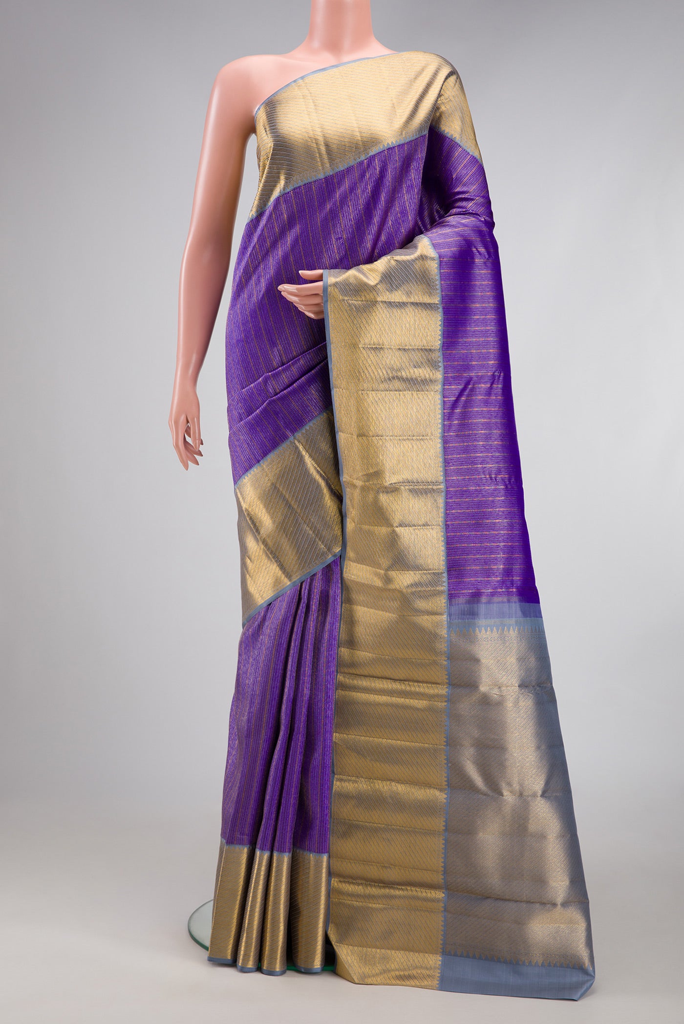 Violet Kanchipuram Silk Saree with Zari Brocade on the body and Zari Border.  displayed on a mannequin