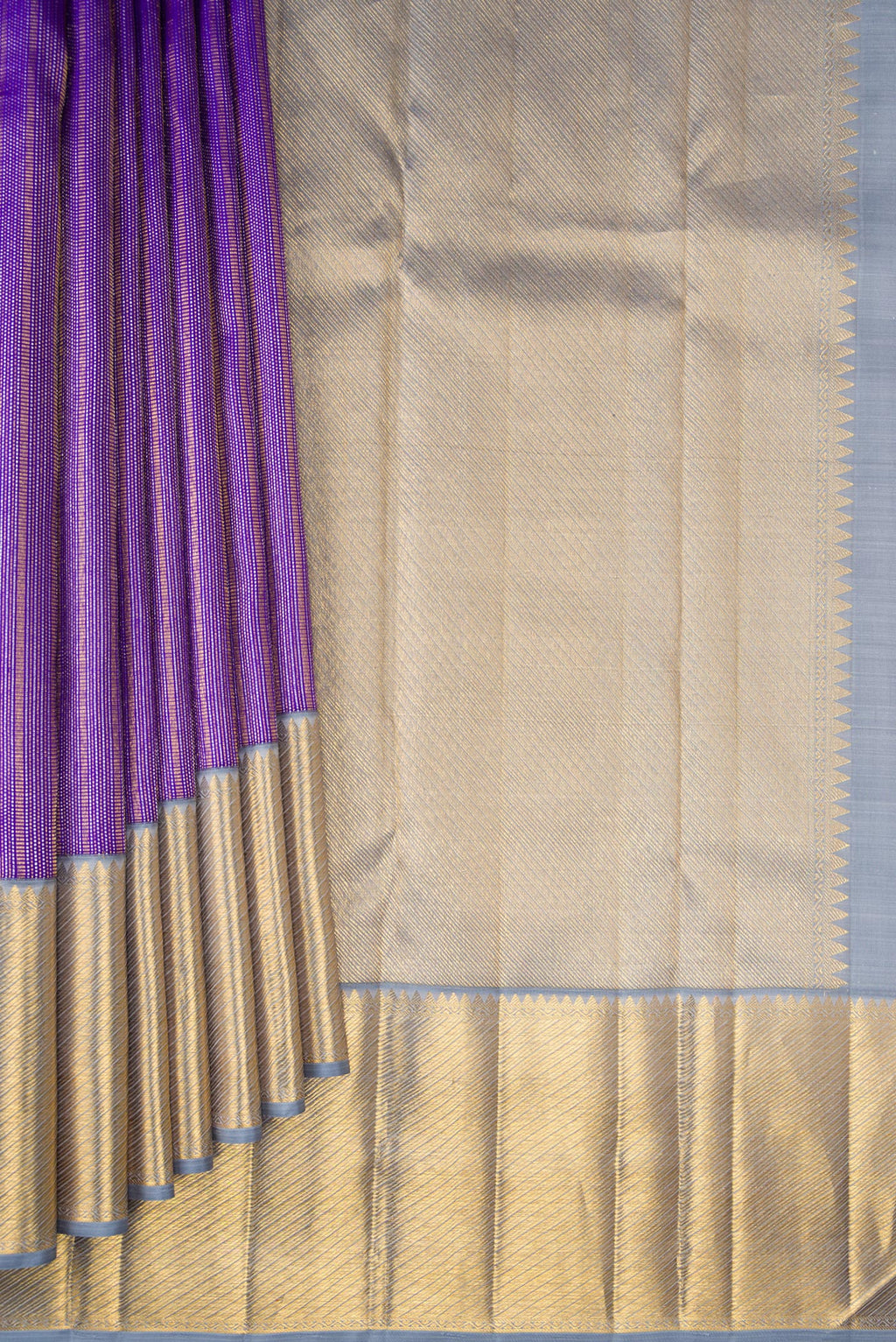 Pleats and pallu of Violet Kanchipuram Silk Saree with Zari Brocade on the body and Zari Border. 