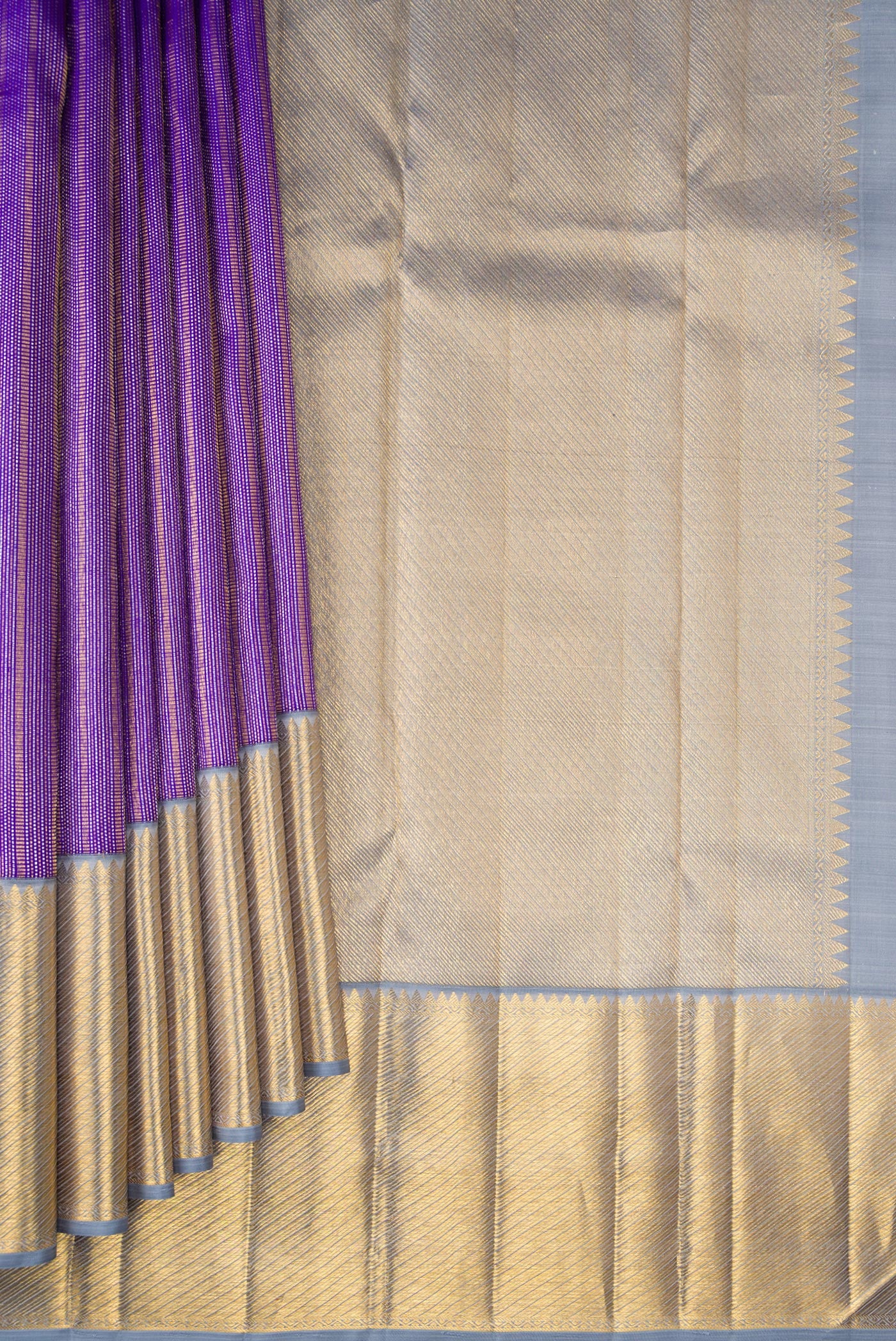 Pleats and pallu of Violet Kanchipuram Silk Saree with Zari Brocade on the body and Zari Border. 