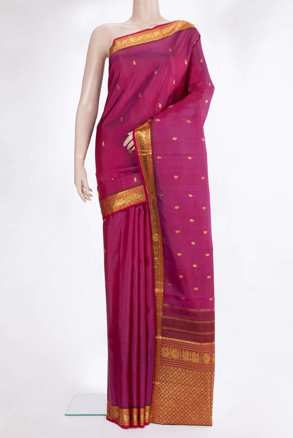 Pure Silk Magenta Kanchipuram Saree with Zari Butta on the body and Zari Border.  displayed on a mannequin