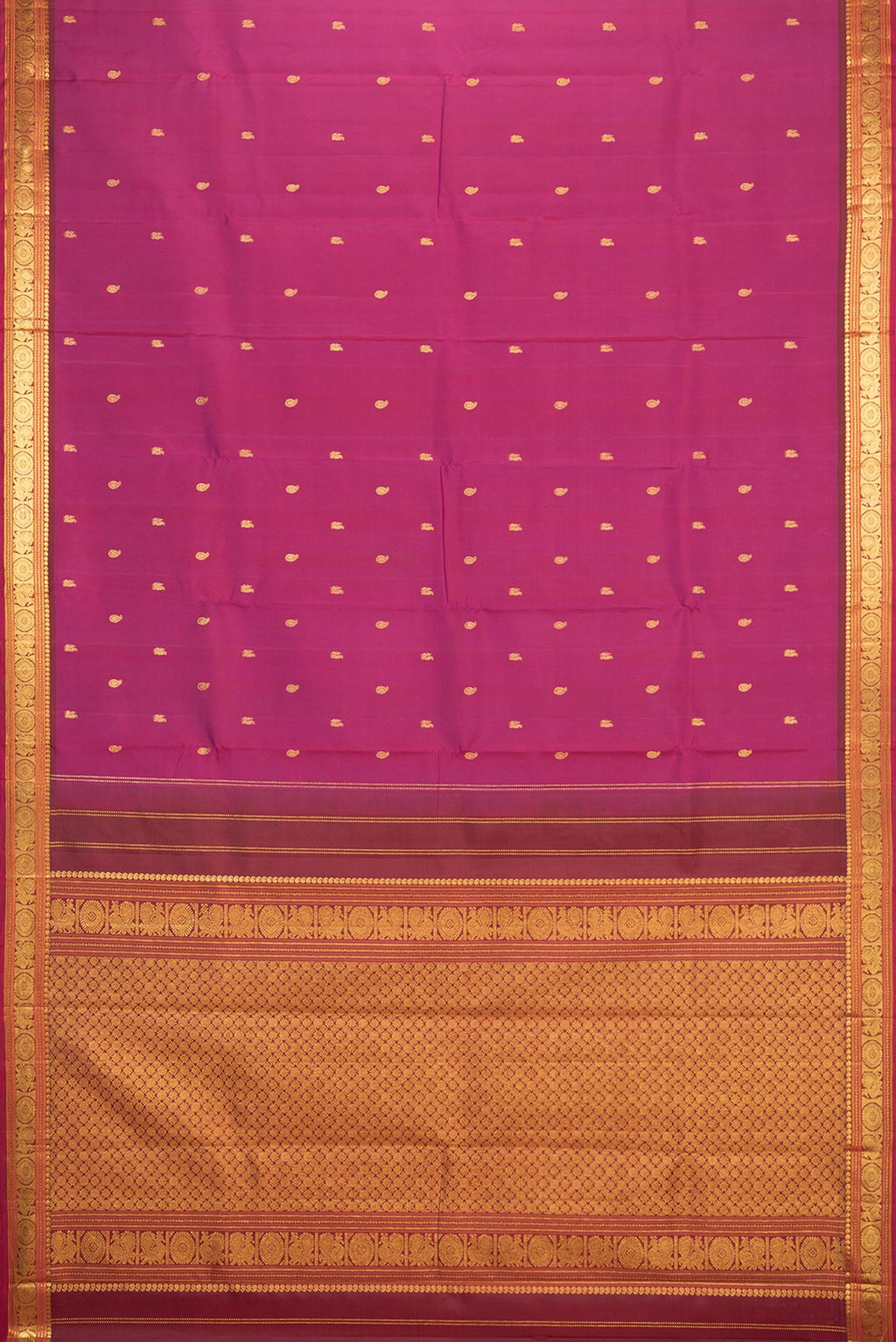 Flat view of Pure Silk Magenta Kanchipuram Saree with Zari Butta on the body and Zari Border. 
