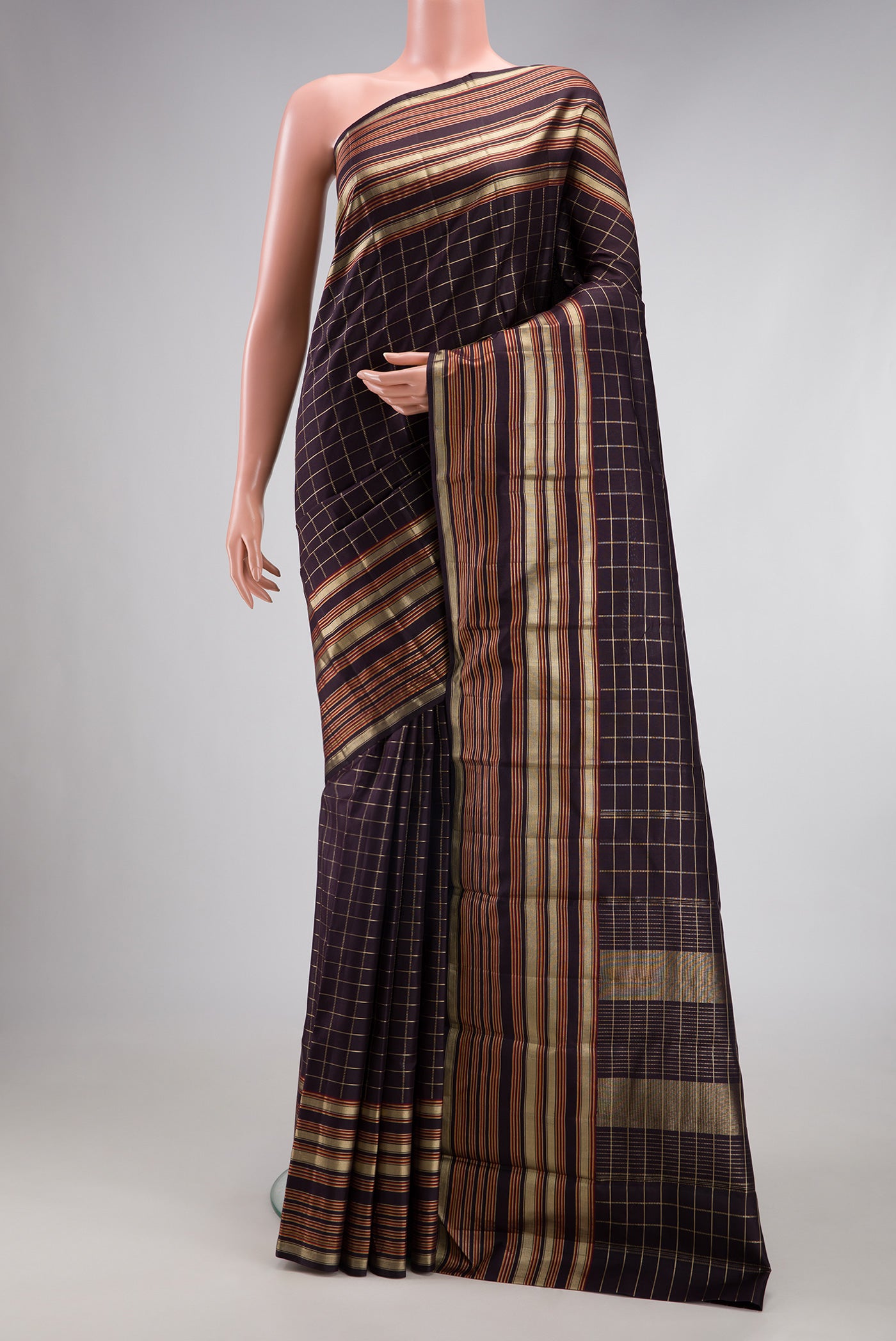Coffee Brown Kanjivaram Silk Saree with Checked design on the body and Zari Border.  displayed on a mannequin