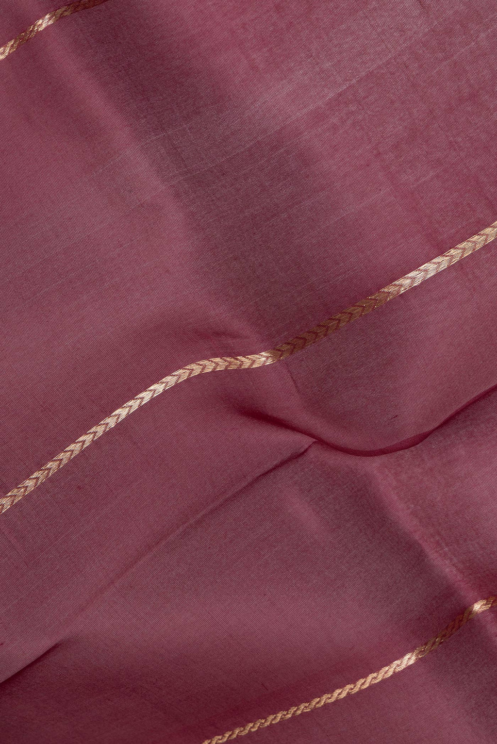 Close up of Coffee Brown Organza Silk Saree with Stripes on the body and Zari Border.  displaying folds
