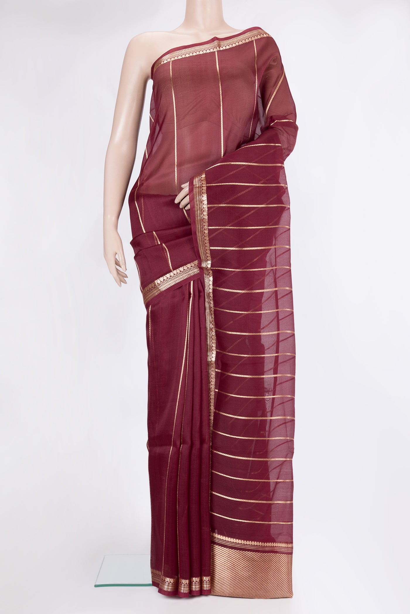 Coffee Brown Organza Silk Saree with Stripes on the body and Zari Border.  displayed on a mannequin