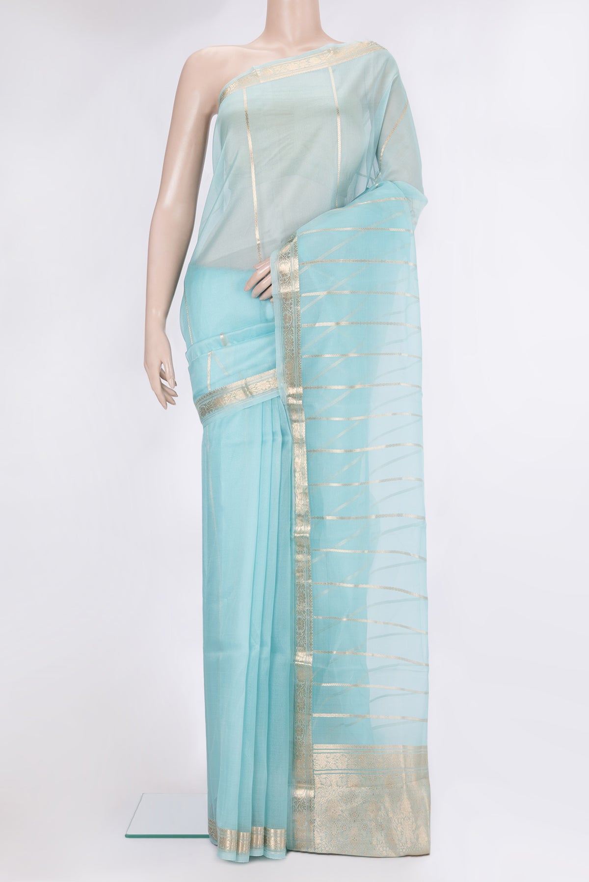 Light Blue Organza Silk Saree with Stripes on the body and Zari Border.  displayed on a mannequin