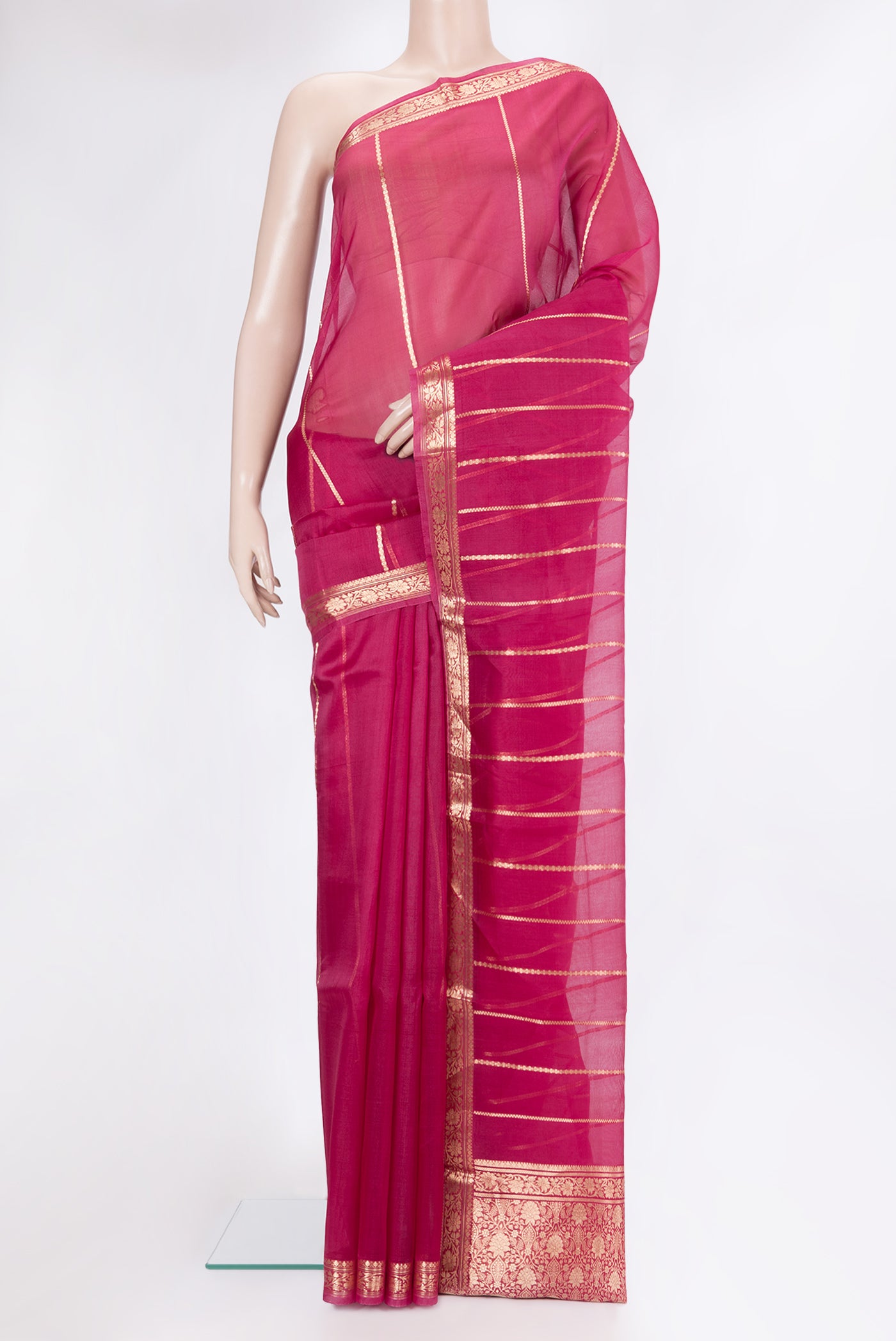 Dark Pink Organza Silk Saree with Stripes on the body and Zari Border.  displayed on a mannequin