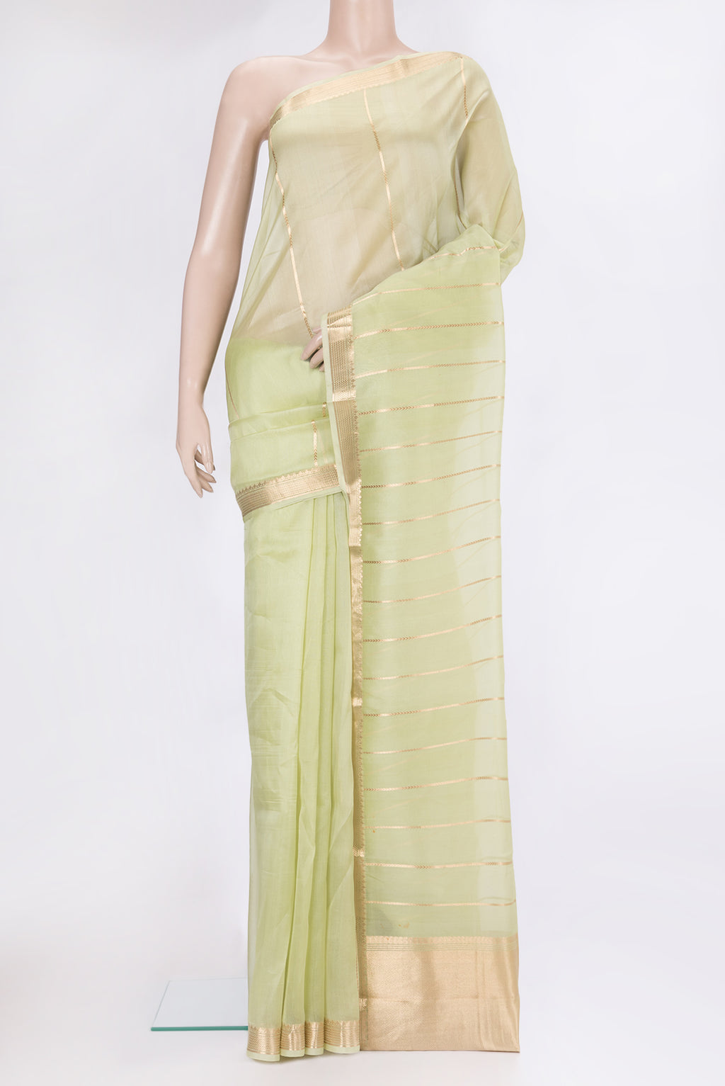 Pista Green Organza Silk Saree with Stripes on the body and Zari Border.  displayed on a mannequin