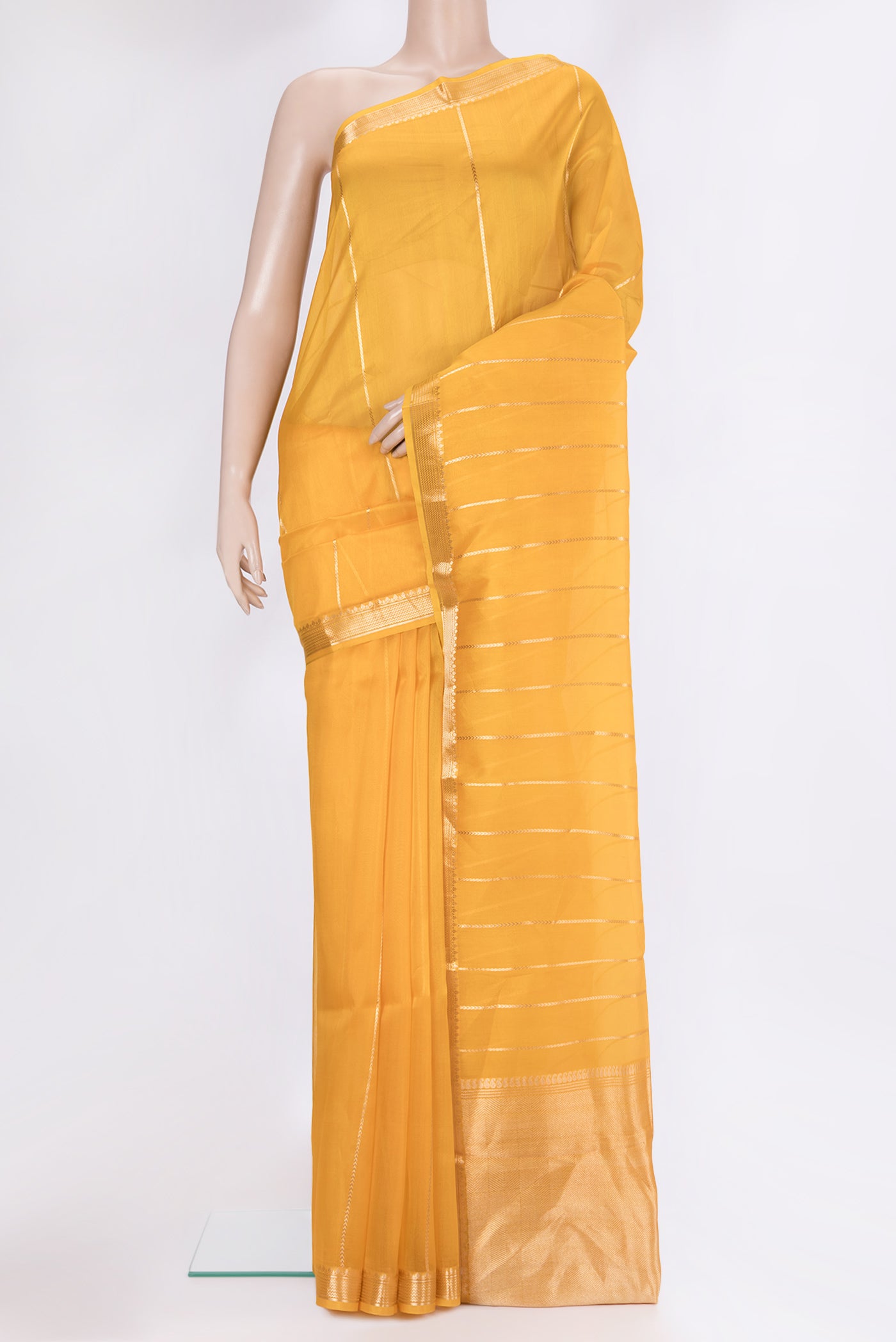Yellow Organza Silk Saree with Stripes on the body and Zari Border.  displayed on a mannequin