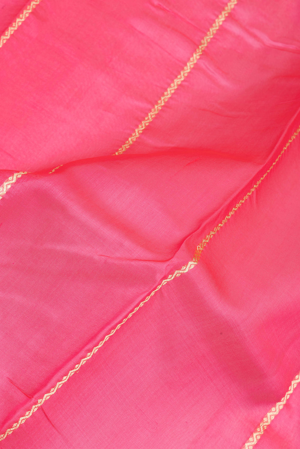 Close up of Pink Dual Tone Organza Silk Saree with Stripes on the body and Zari Border.  displaying folds