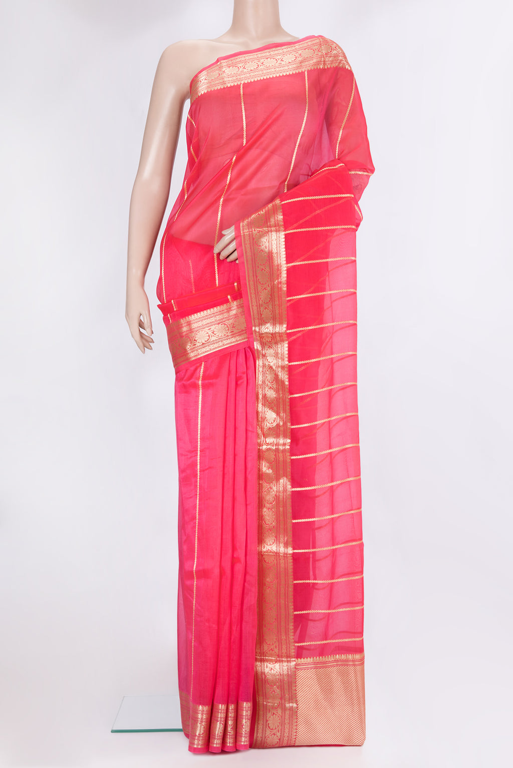 Pink Dual Tone Organza Silk Saree with Stripes on the body and Zari Border.  displayed on a mannequin