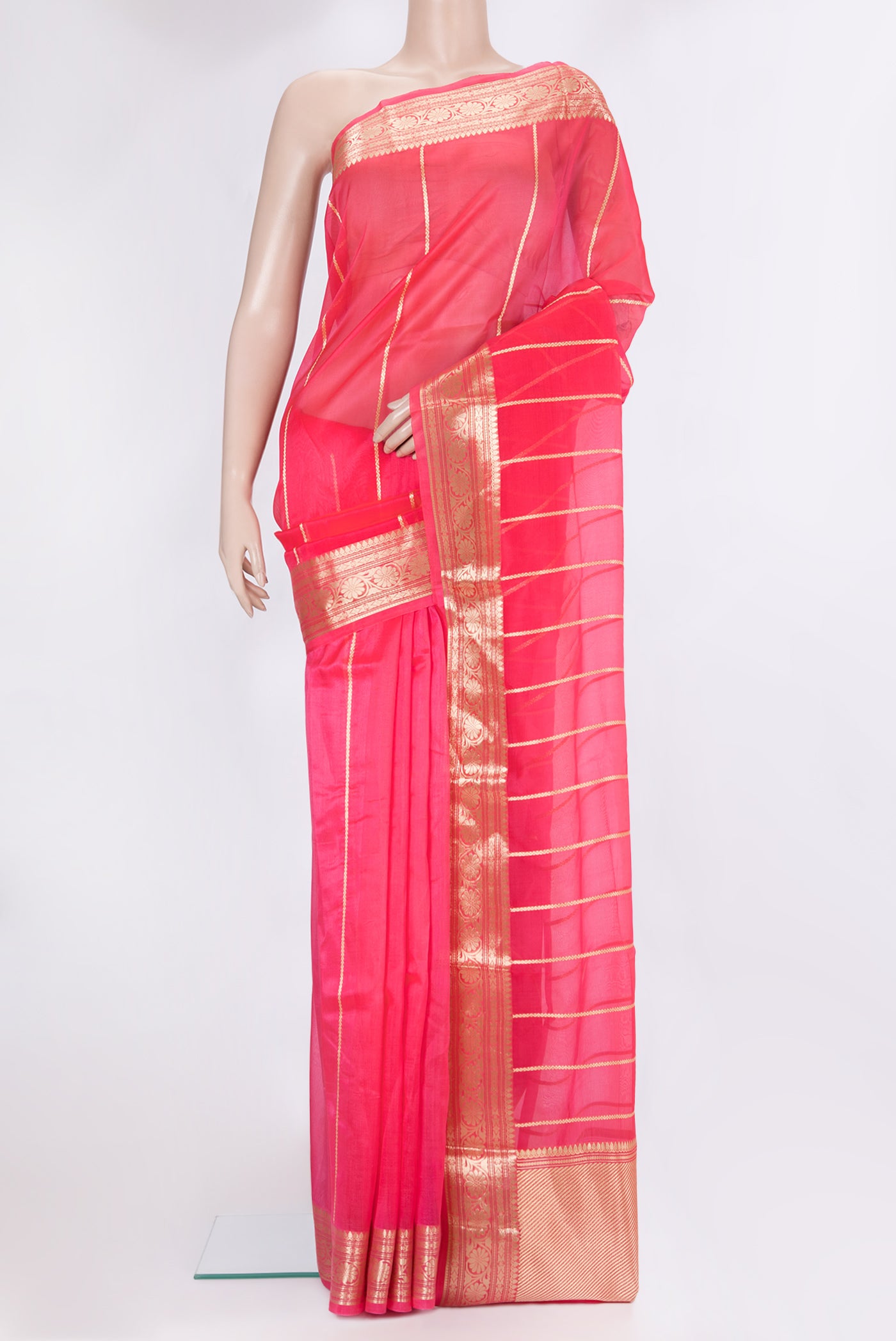 Pink Dual Tone Organza Silk Saree with Stripes on the body and Zari Border.  displayed on a mannequin