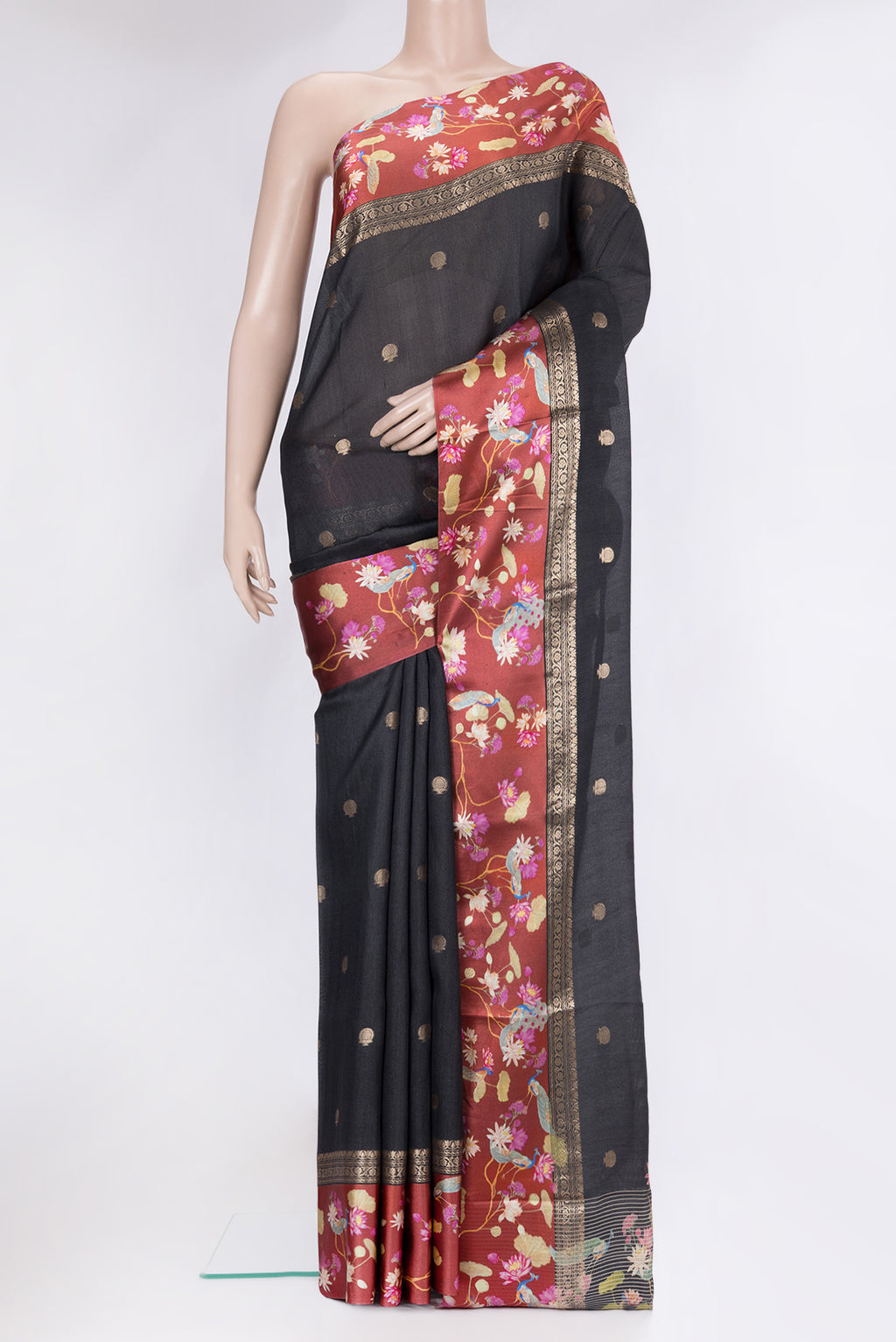 Black Tussar Silk Saree with Zari Butta on the body and Fancy Border.  displayed on a mannequin