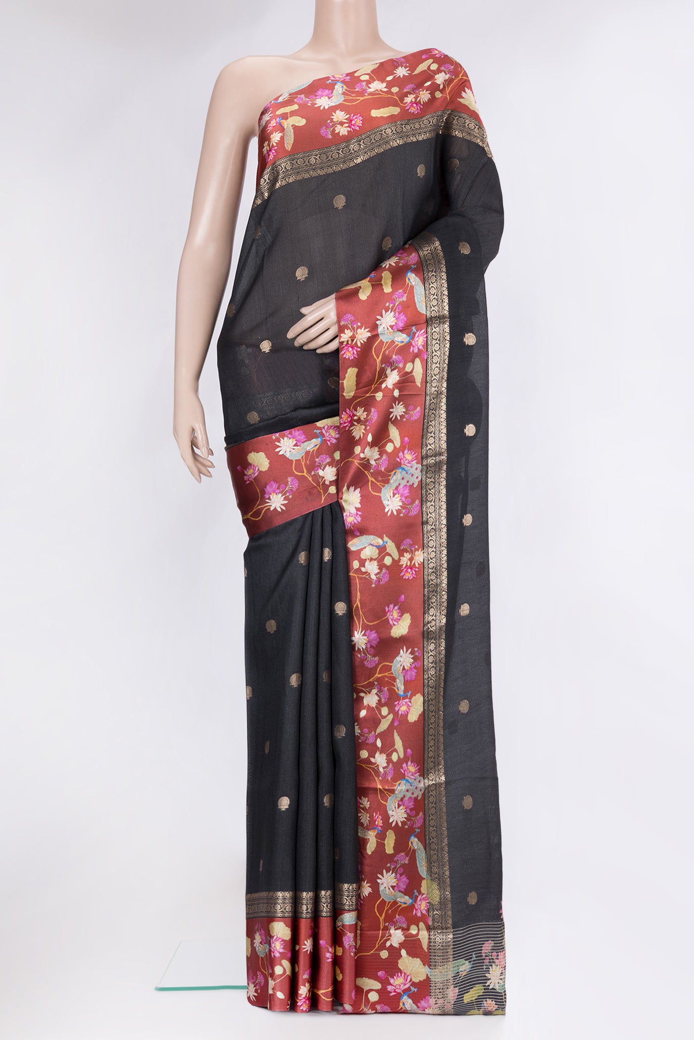 Black Tussar Silk Saree with Zari Butta on the body and Fancy Border.  displayed on a mannequin