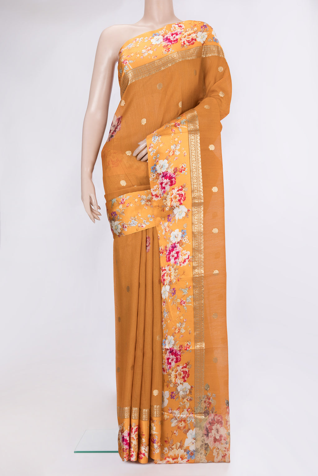 Mustard Tussar Silk Saree with Zari Butta on the body and Fancy Border.  displayed on a mannequin