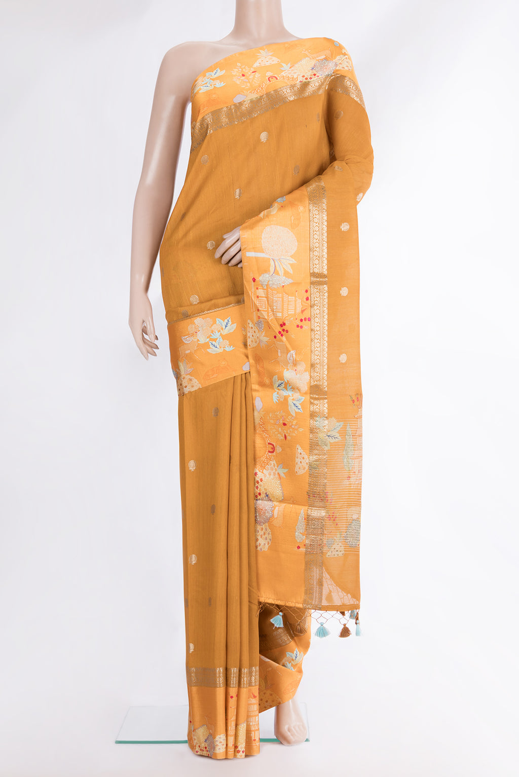 Mustard Tussar Saree with Zari Butta on the body and Fancy Border.  displayed on a mannequin
