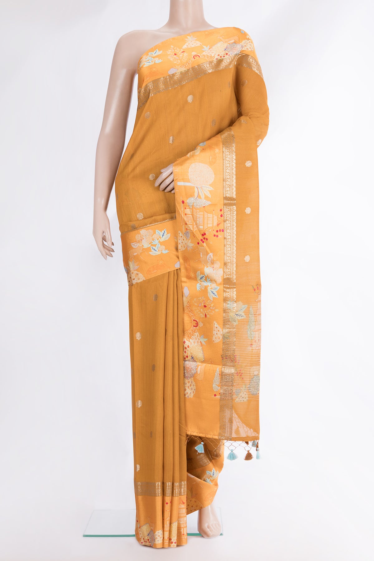 Mustard Tussar Saree with Zari Butta on the body and Fancy Border.  displayed on a mannequin