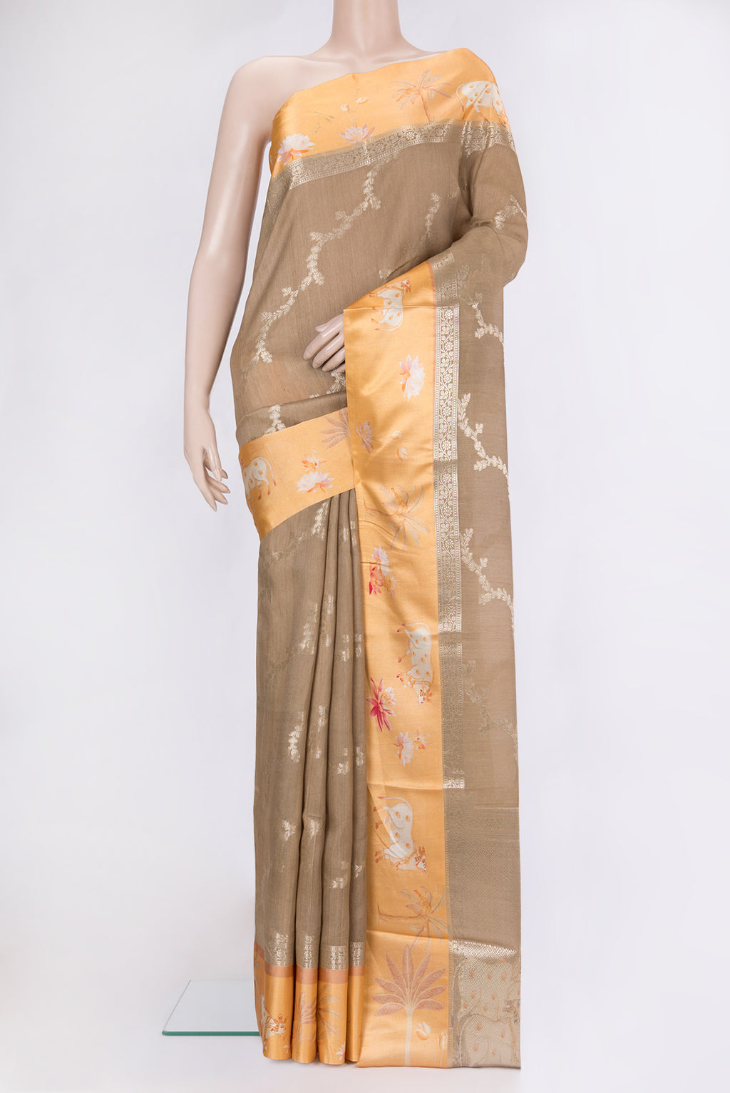 Dark Beige Tussar Silk Saree with Zari Brocade on the body and Fancy Border.  displayed on a mannequin