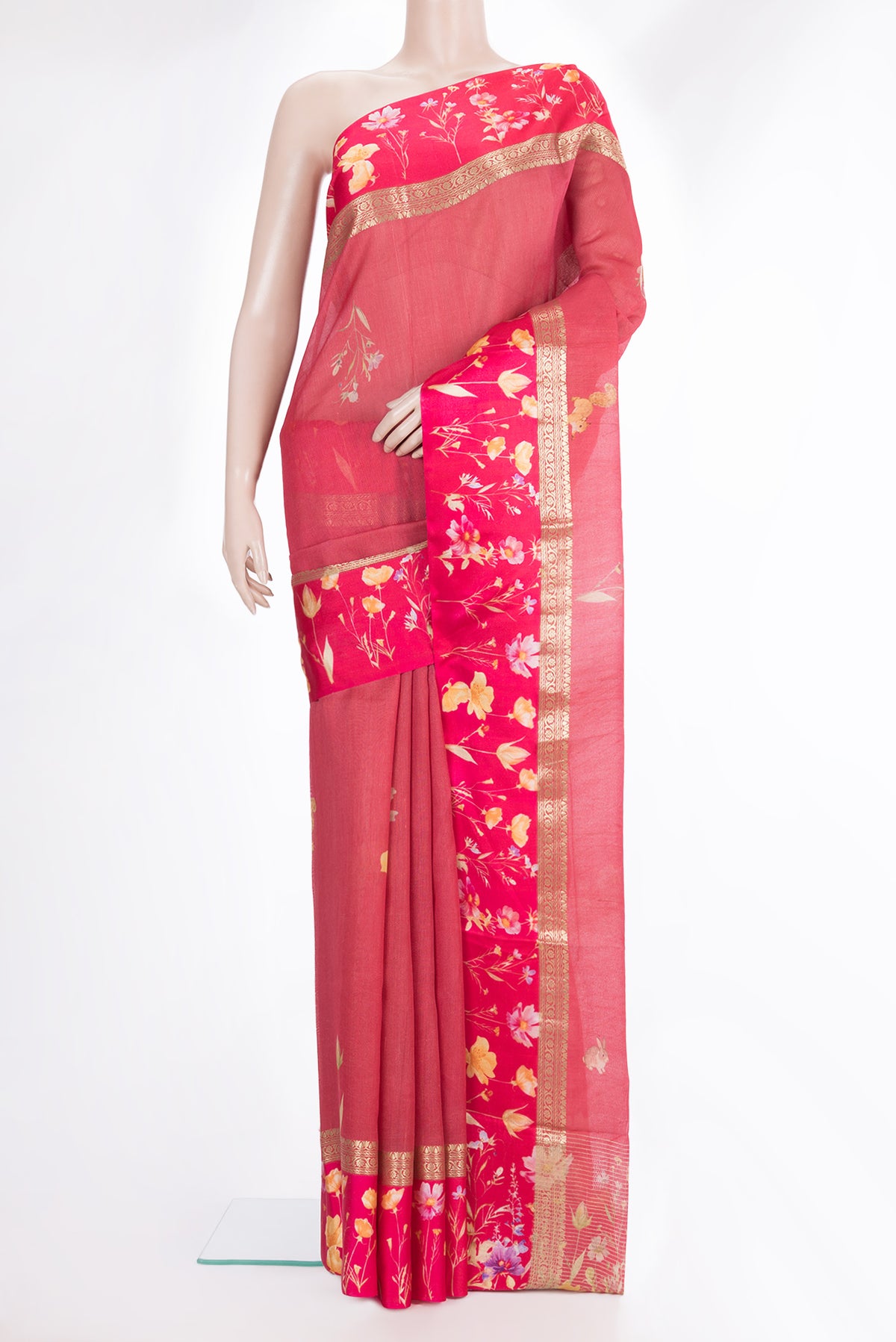 Coral Tussar Saree with Printed design on the body and Fancy Border.  displayed on a mannequin