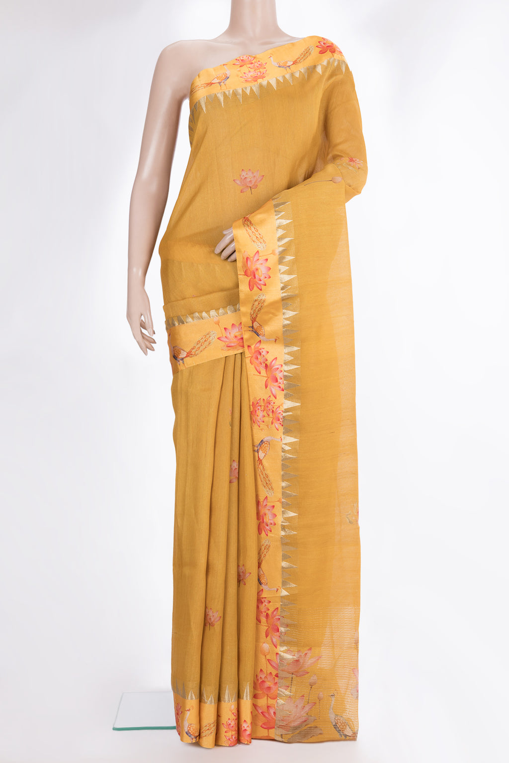 Mustard Tussar Saree with Printed design on the body and Fancy Border.  displayed on a mannequin