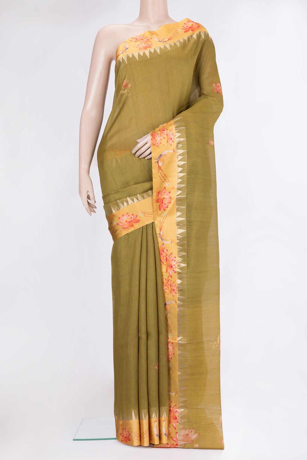 Mehandi Green Tussar Silk Saree with Printed design on the body and Fancy Border.  displayed on a mannequin