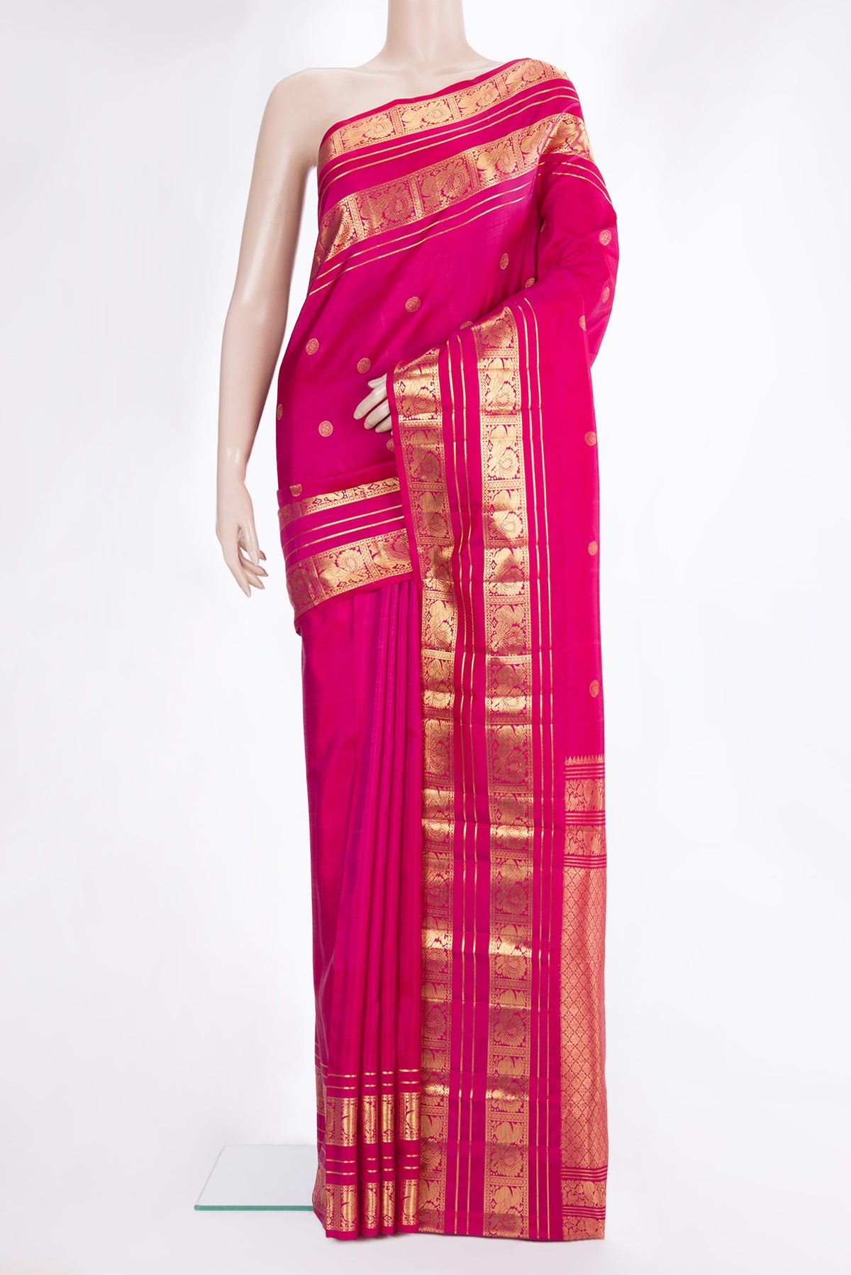 Pure Silk Pink Kanjivaram Saree with Zari Butta on the body and Fancy Border.  displayed on a mannequin