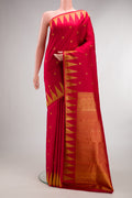 Pure Silk Red Kanjivaram Saree with Zari Butta on the body and Temple Border.  displayed on a mannequin